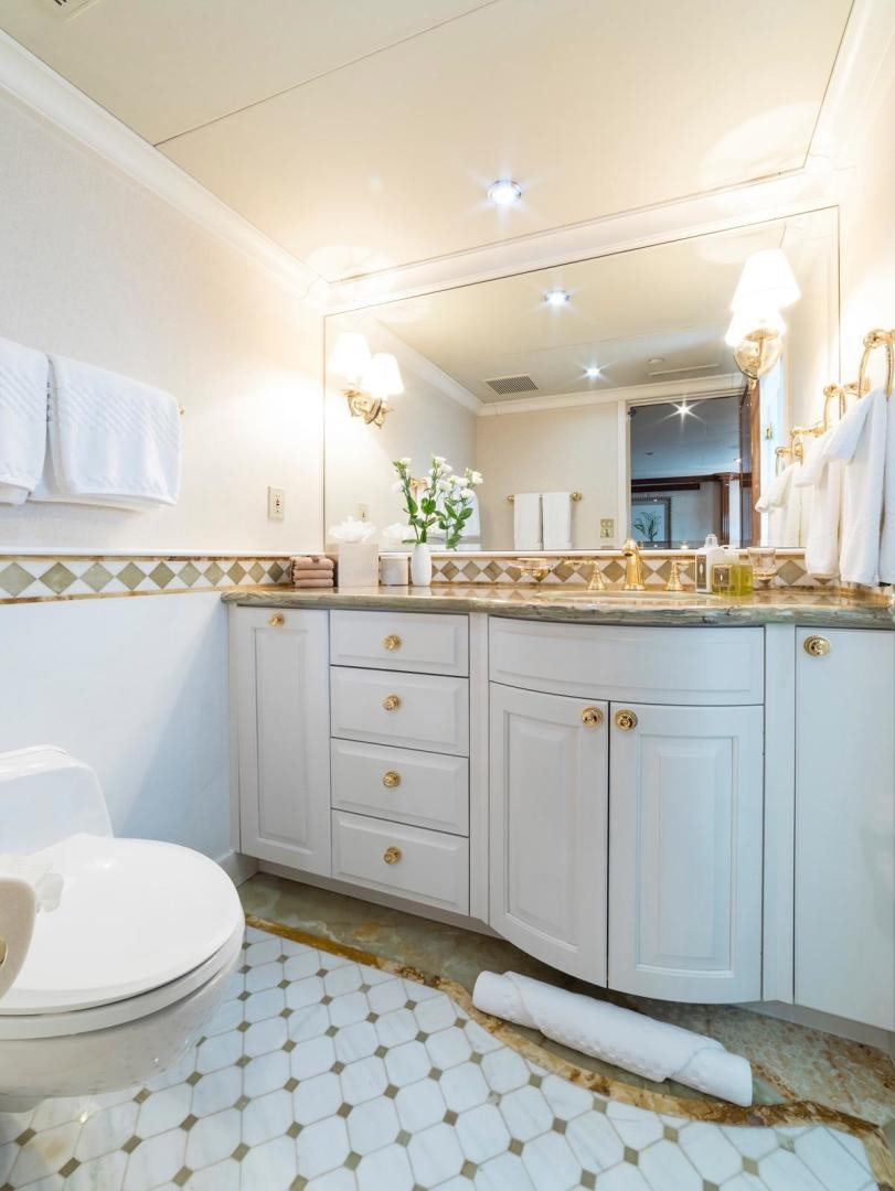 a bathroom with a sink and a mirror aboard POPEYE Yacht for Sale