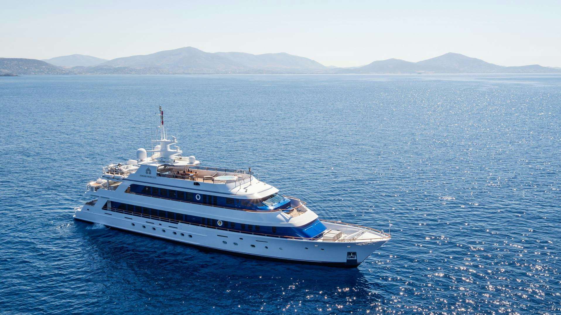 a large white boat in the water aboard IONIAN PRINCESS Yacht for Sale