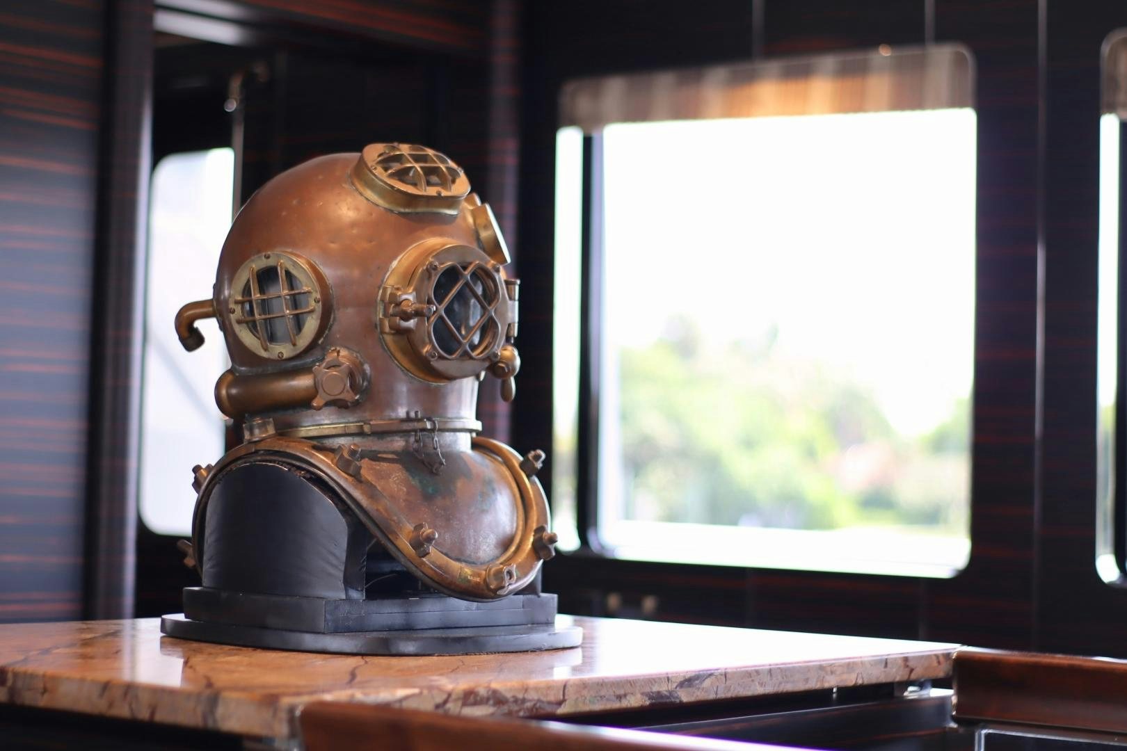 a brass bell with a handle aboard QING Yacht for Sale