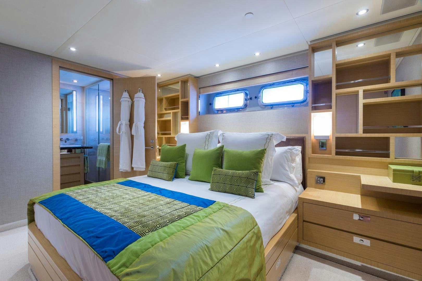 a bedroom with a bed and a closet aboard QING Yacht for Sale