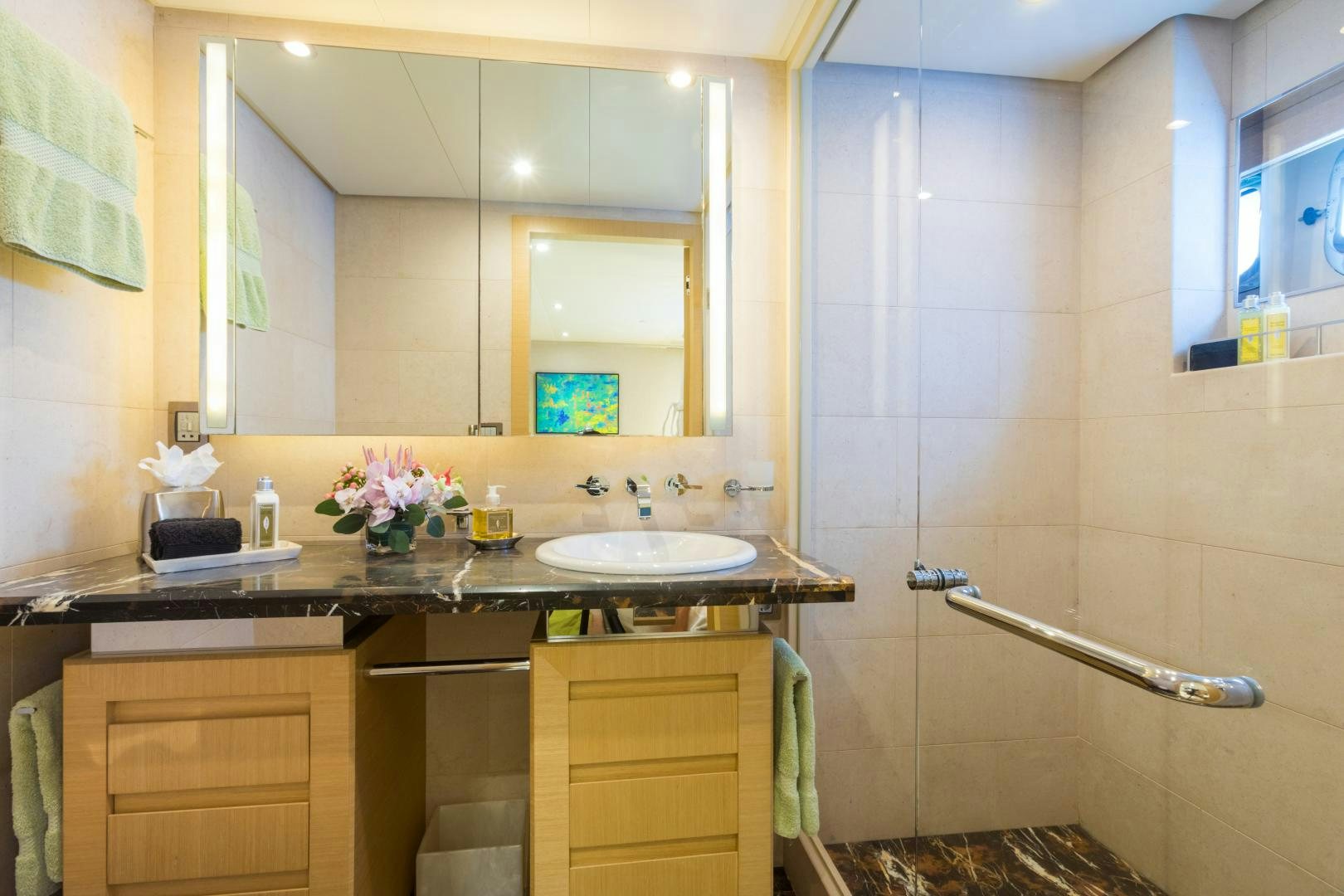 a bathroom with a sink and mirror aboard QING Yacht for Sale