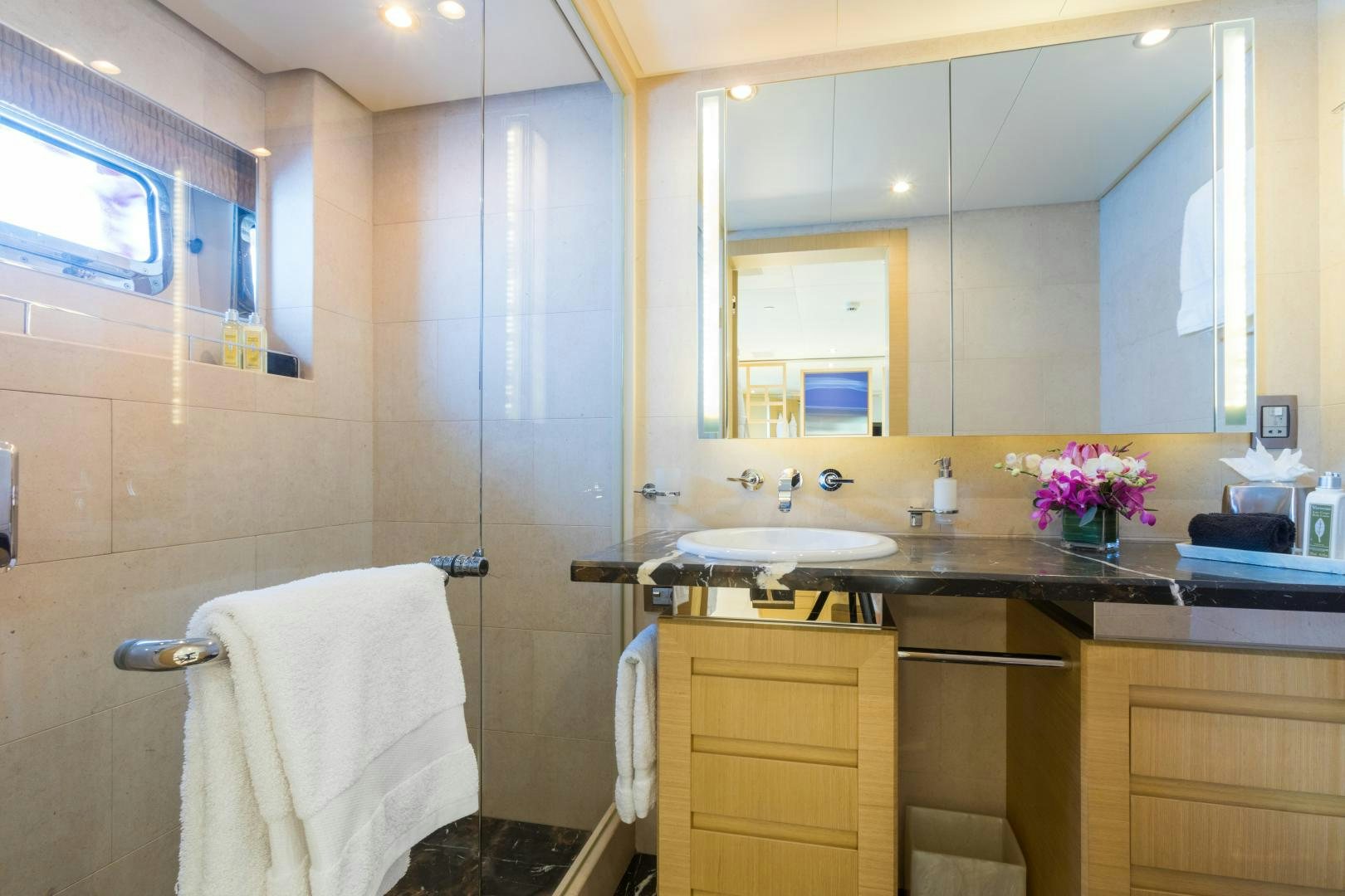 a bathroom with a shower and sink aboard QING Yacht for Sale