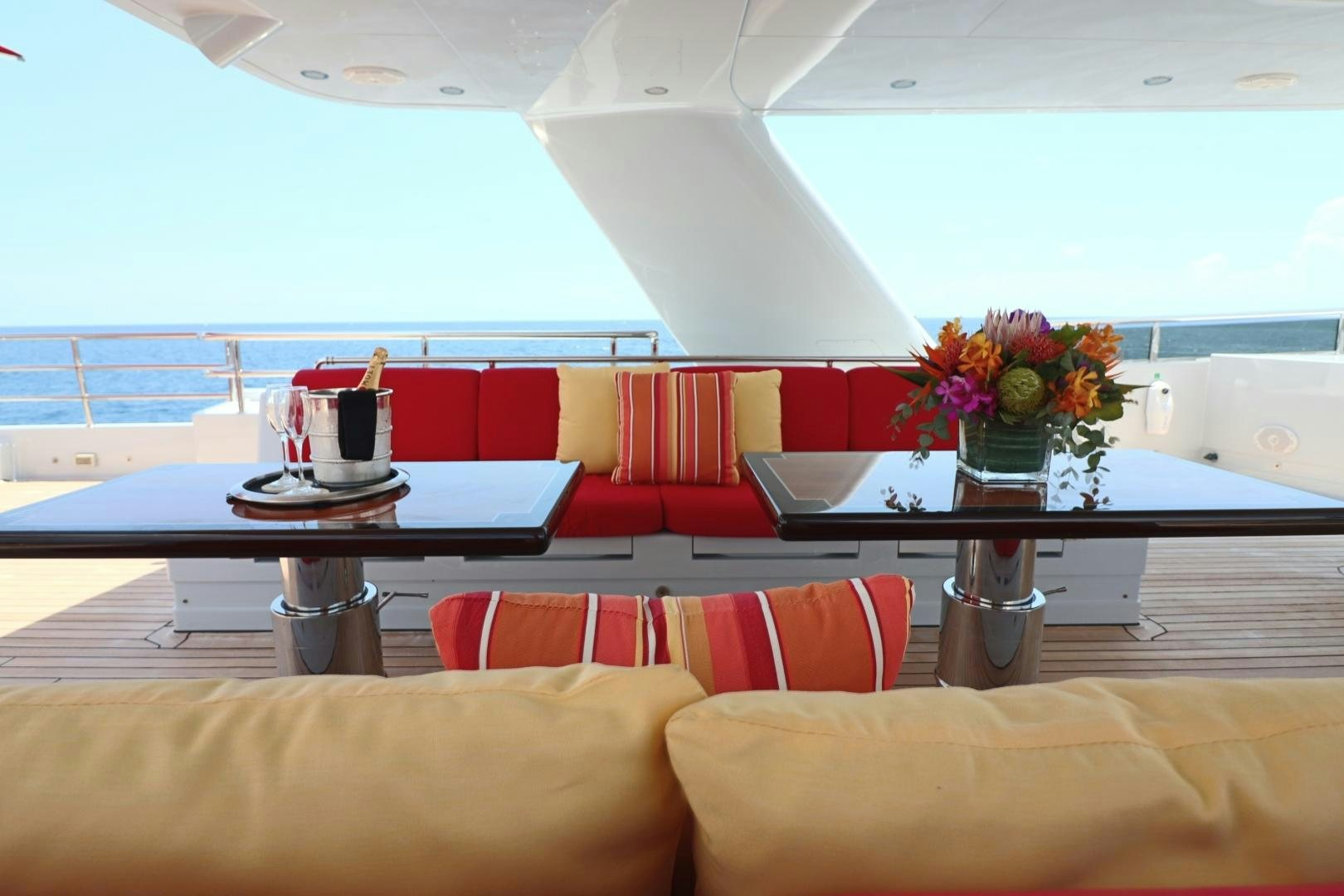 a room with a table and chairs aboard QING Yacht for Sale