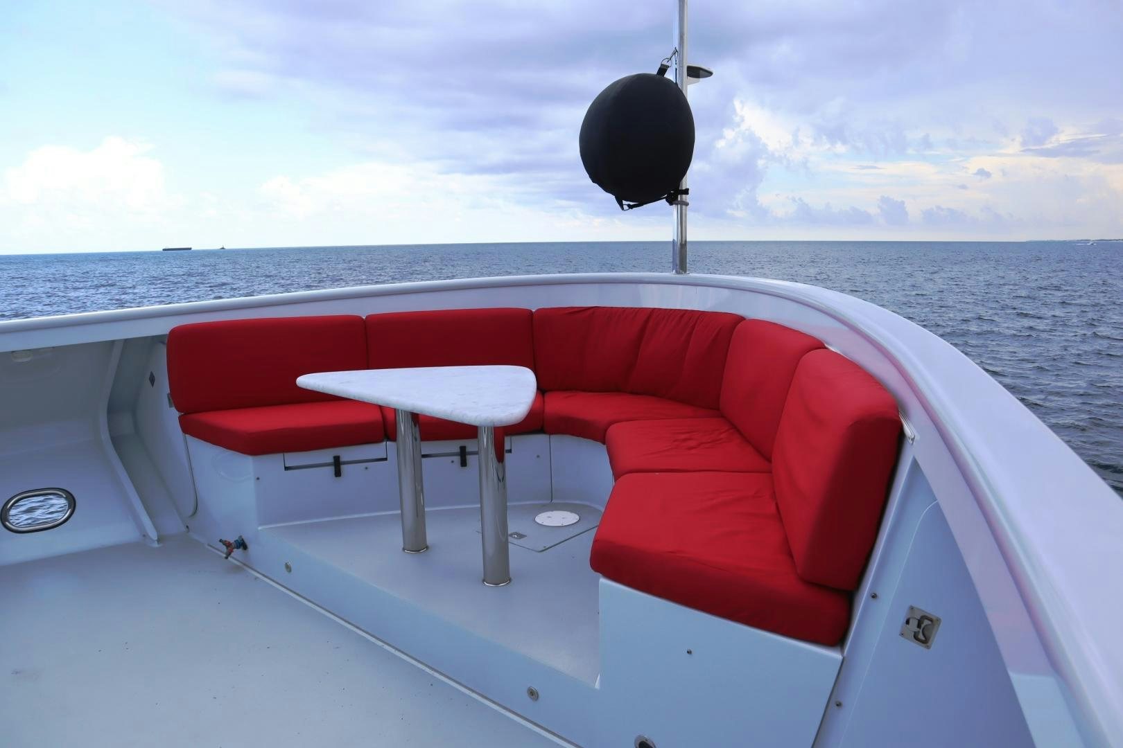 a boat with a table and chairs on it aboard QING Yacht for Sale