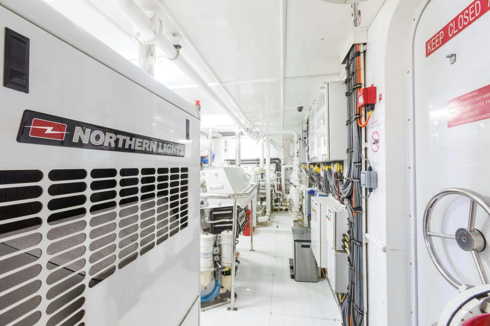 a room with white machines aboard QING Yacht for Sale