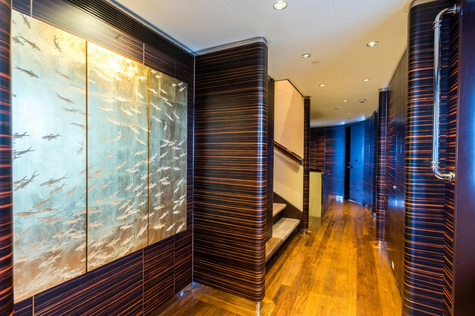 a room with a wood floor and a glass wall aboard QING Yacht for Sale