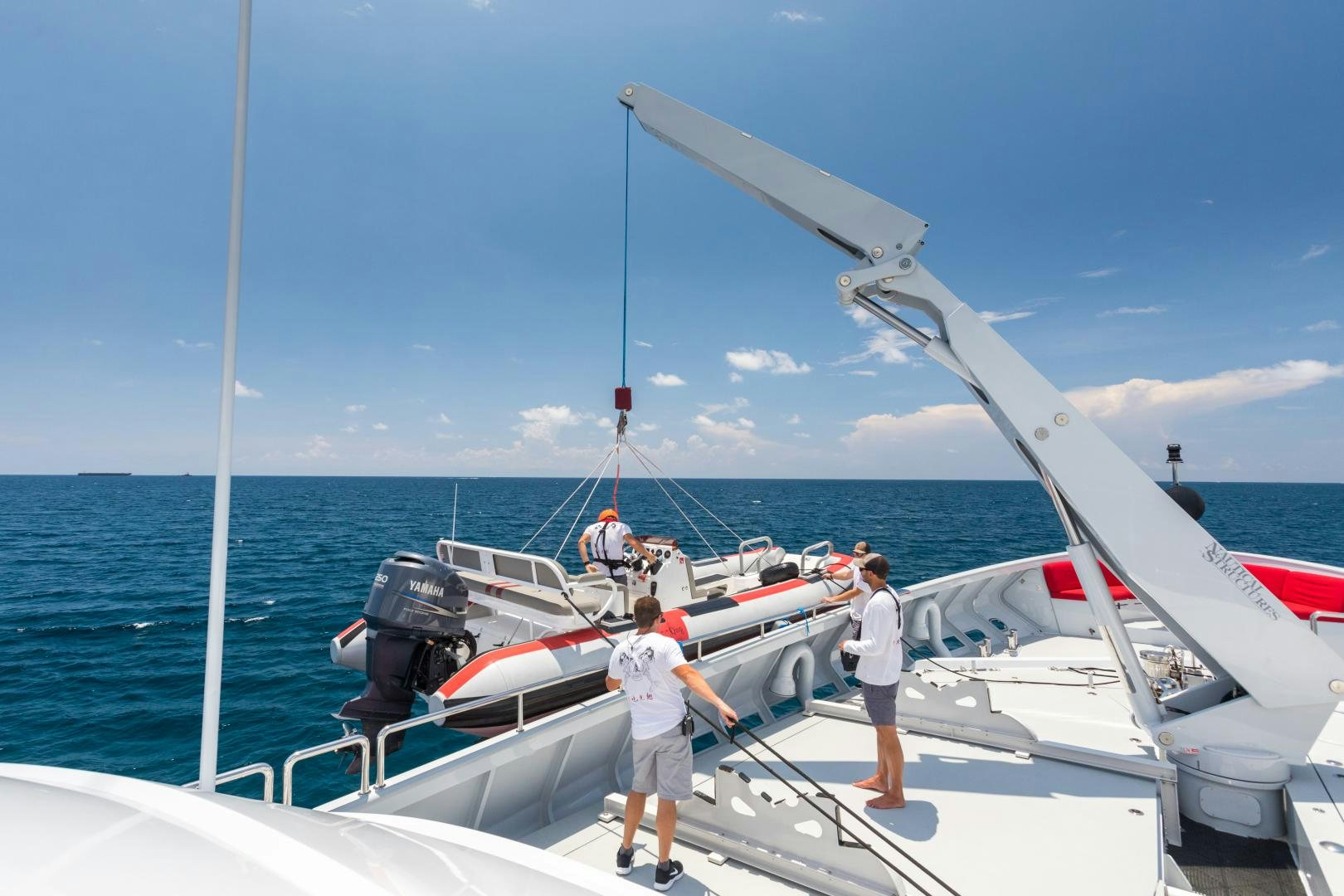 a couple of people on a boat aboard QING Yacht for Sale