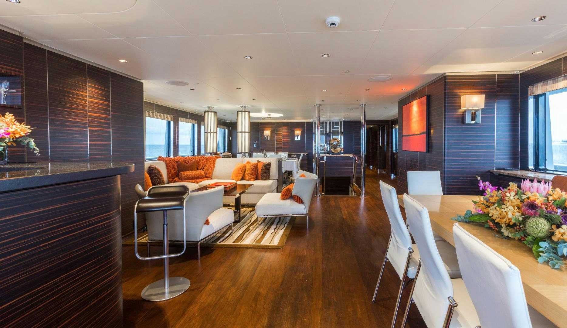 a living room with a wood floor aboard QING Yacht for Sale