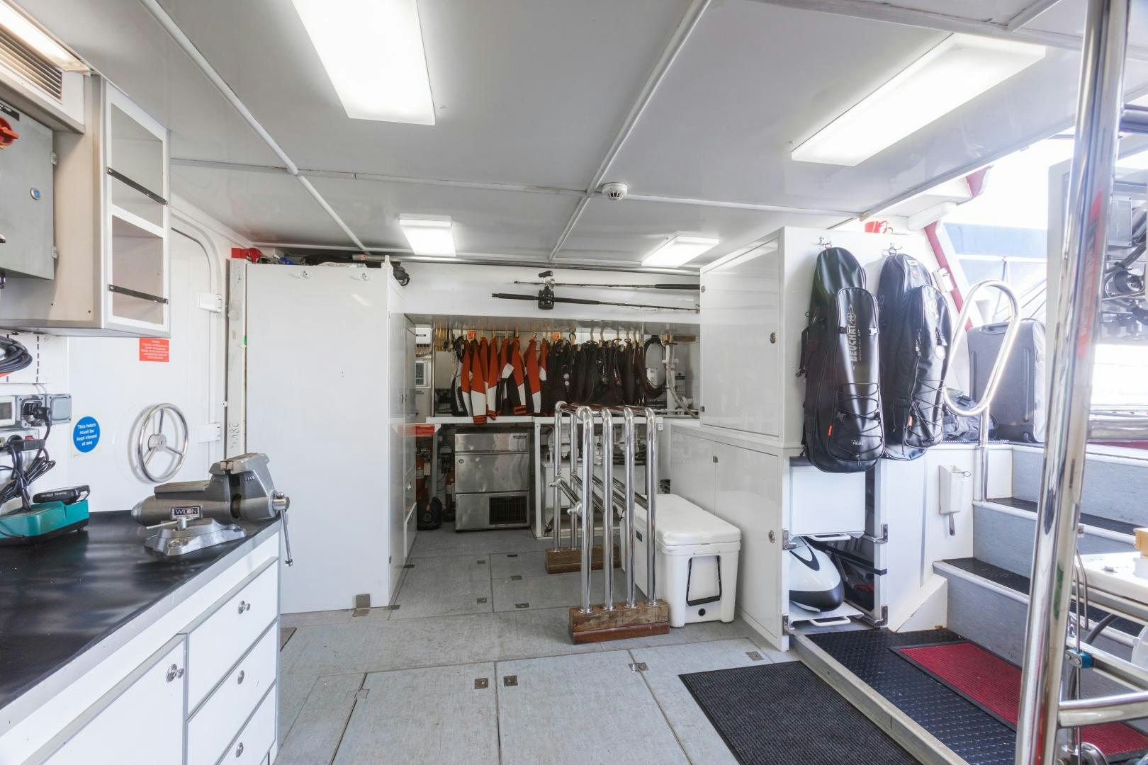 a room with a lot of clothes on the swinger aboard QING Yacht for Sale