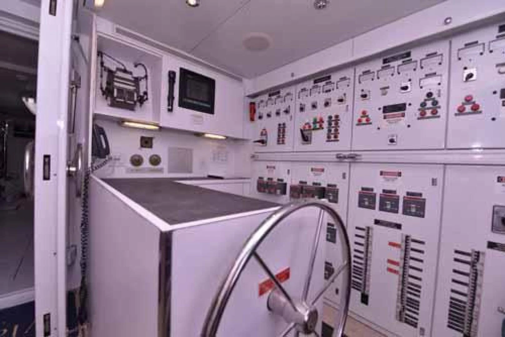 a room with white cabinets and a black counter aboard UTOPIA III Yacht for Sale