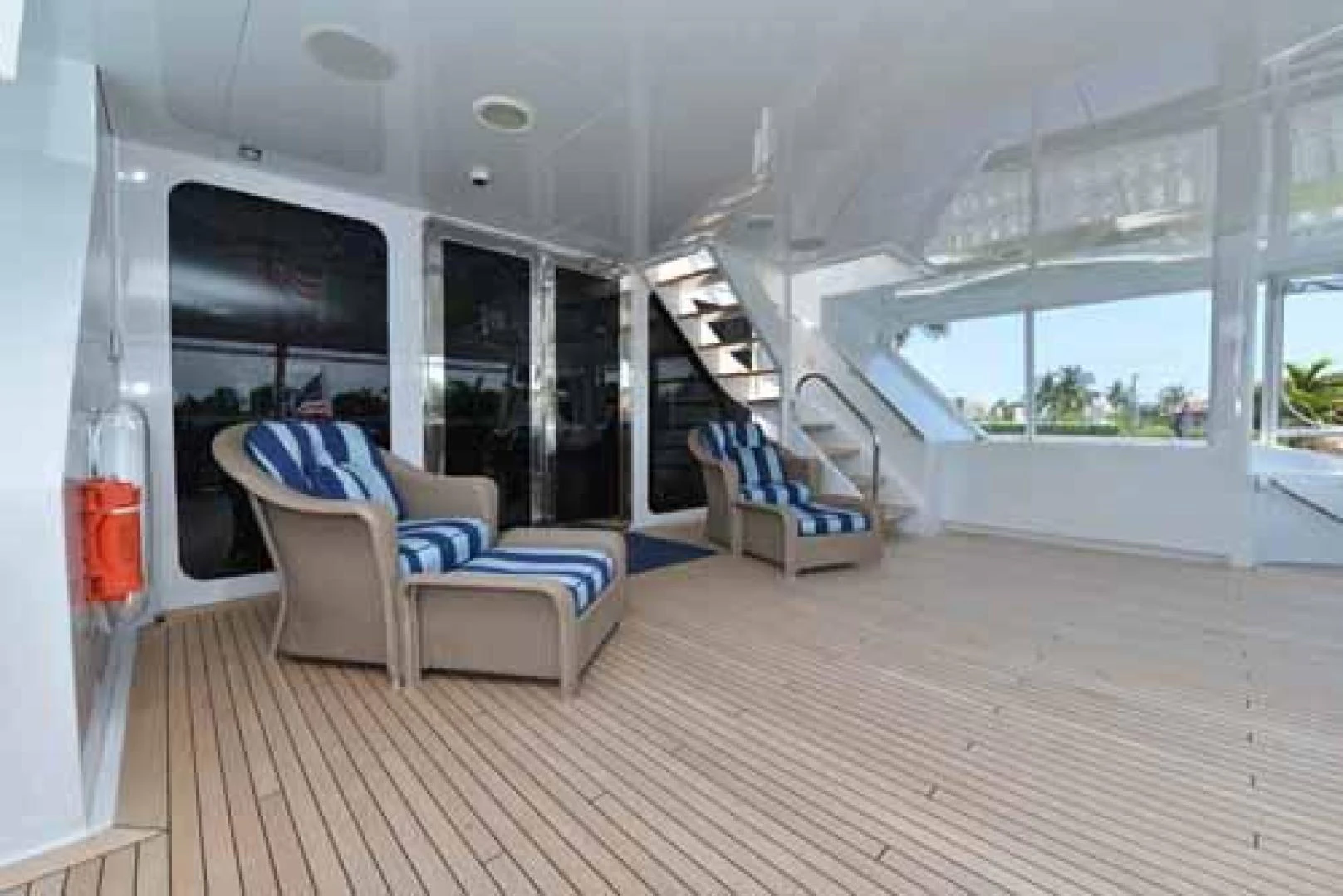 a room with a couch and a wood floor aboard UTOPIA III Yacht for Sale