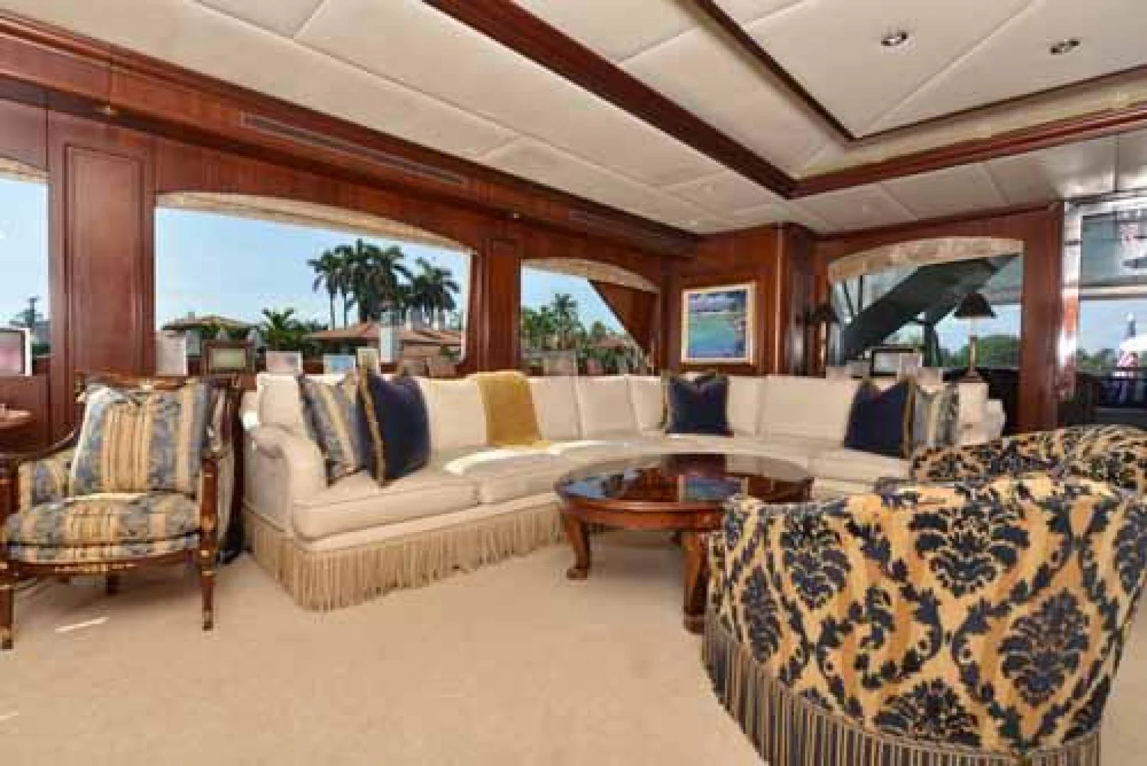 a living room with a couch and a table aboard UTOPIA III Yacht for Sale