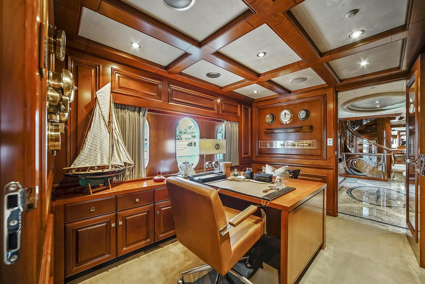 a kitchen with a table and chairs aboard ARTEMIS Yacht for Sale