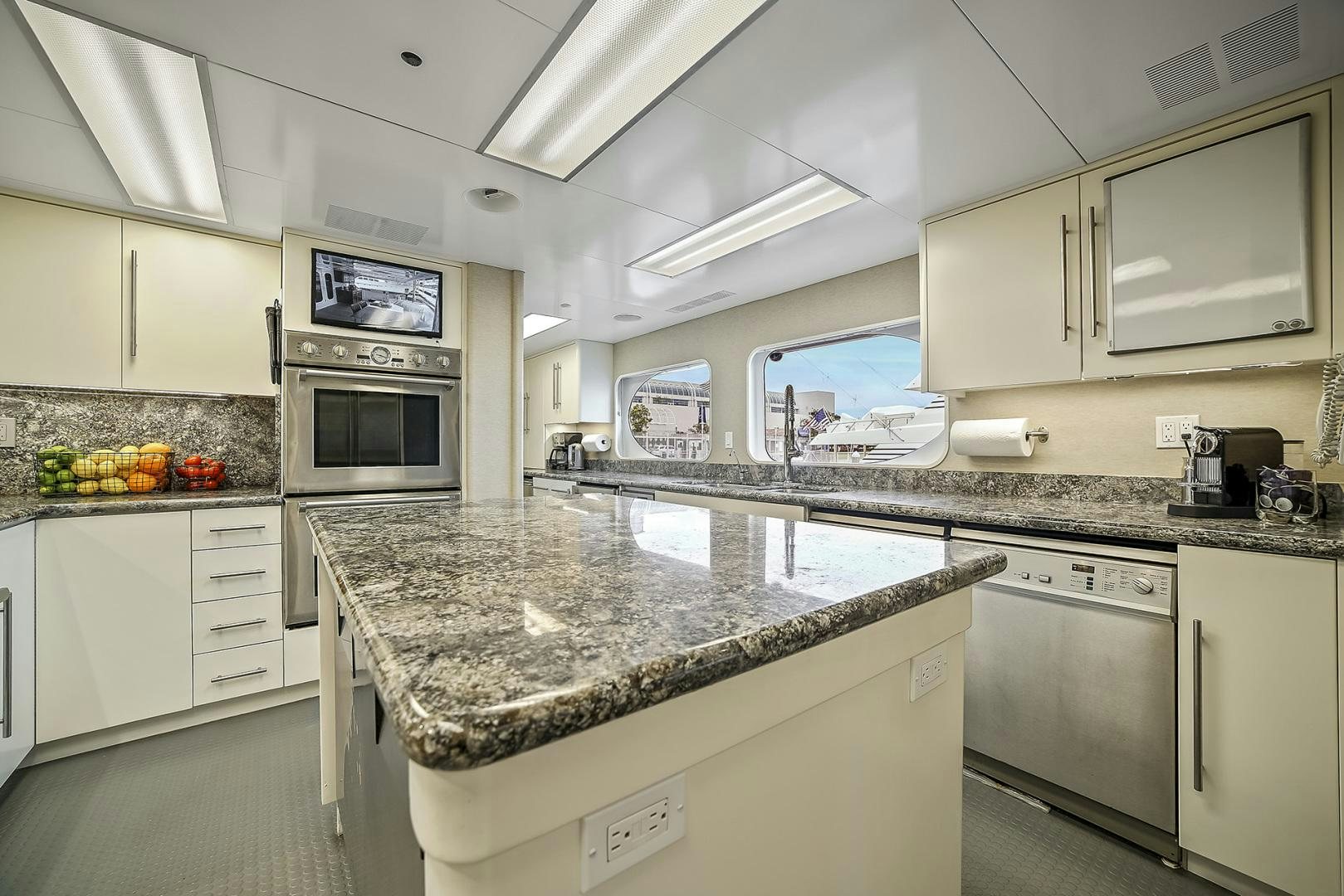 a kitchen with a marble counter top aboard ARTEMIS Yacht for Sale