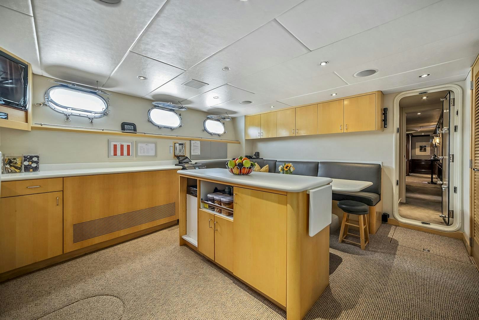 a large kitchen with a large island aboard ARTEMIS Yacht for Sale