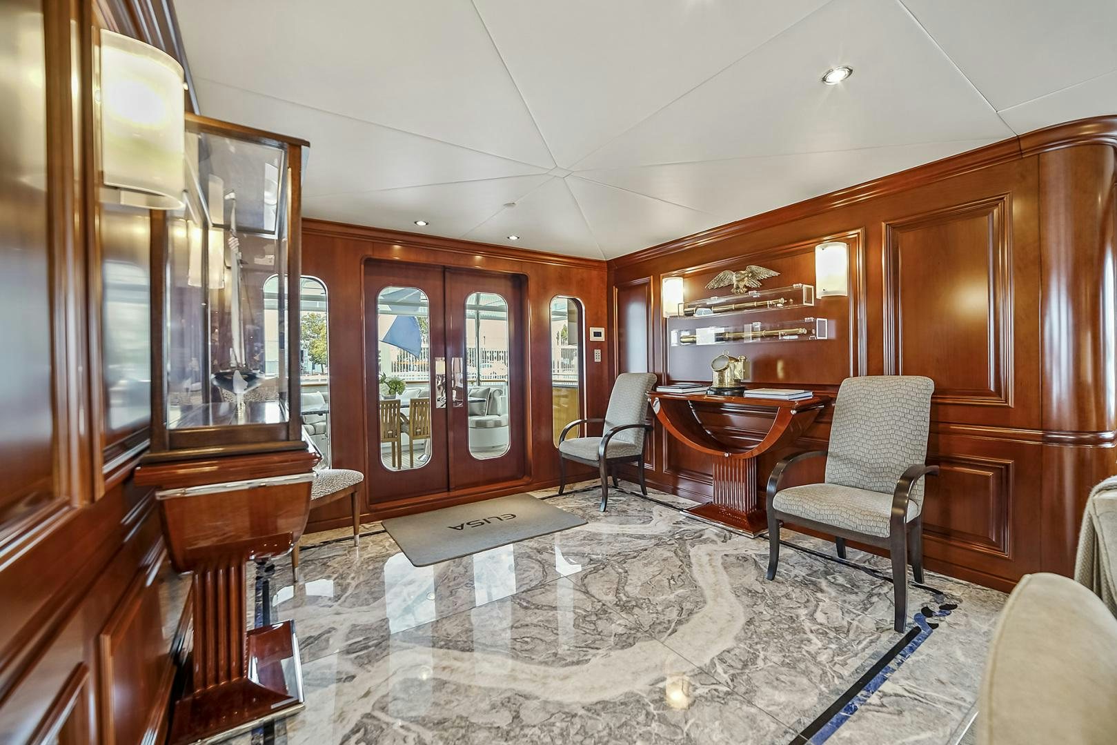 a large room with a table and chairs aboard ARTEMIS Yacht for Sale