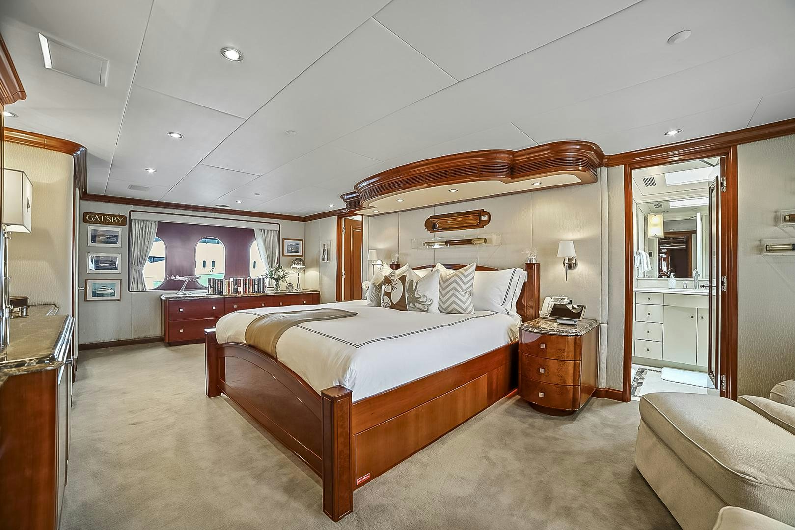 a bedroom with a bed and a desk aboard ARTEMIS Yacht for Sale
