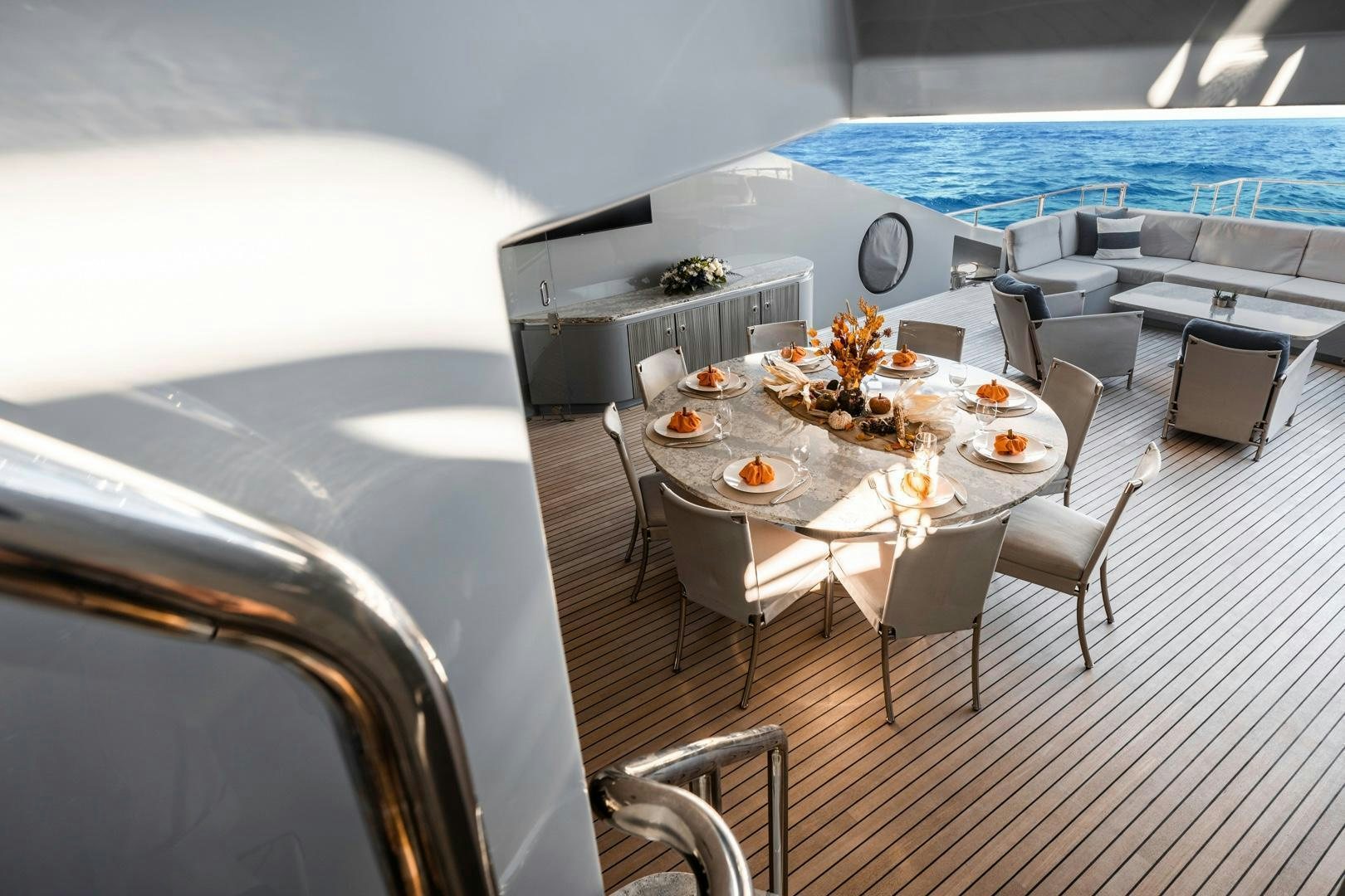 a dining room with a large white table and chairs aboard AQUANOVA Yacht for Sale