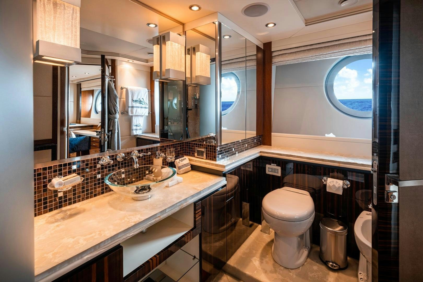 a bathroom with a large mirror aboard AQUANOVA Yacht for Sale