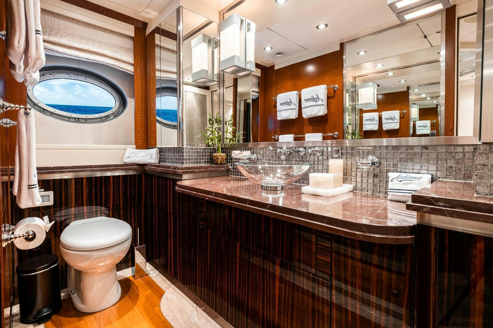 a bathroom with a large mirror aboard AQUANOVA Yacht for Sale