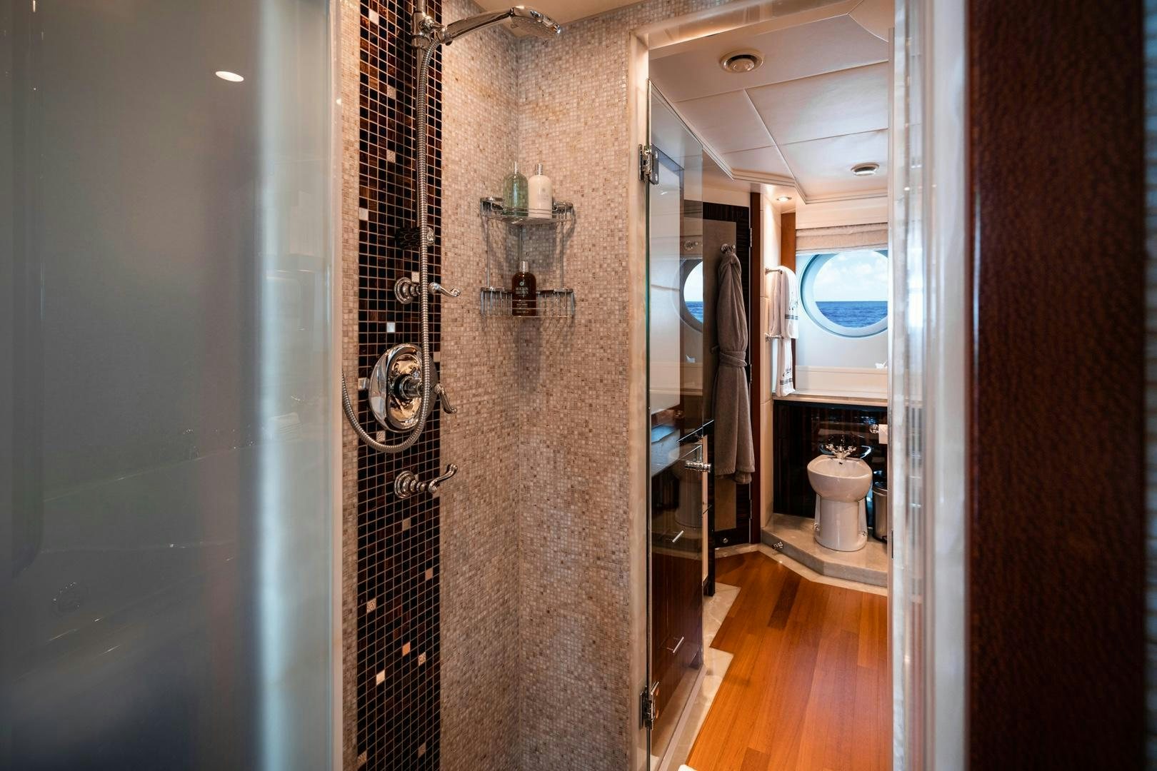 a bathroom with a glass shower aboard AQUANOVA Yacht for Sale