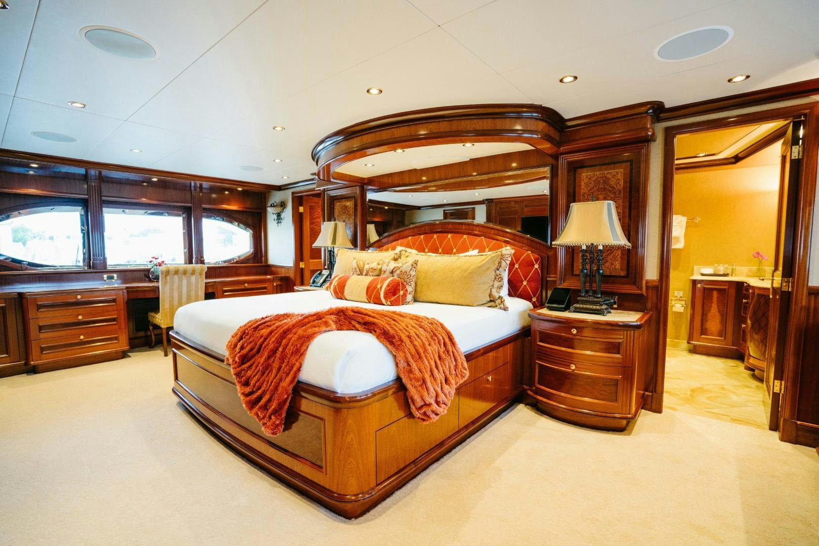 a large bed in a room aboard EXCELLENCE Yacht for Sale
