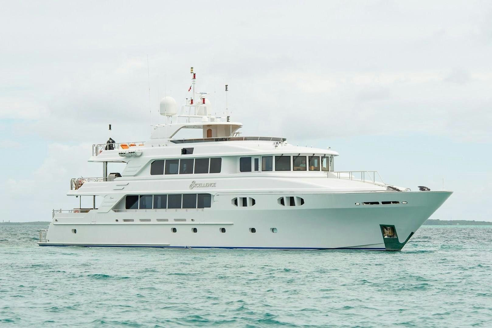 a large white boat in the water aboard EXCELLENCE Yacht for Sale