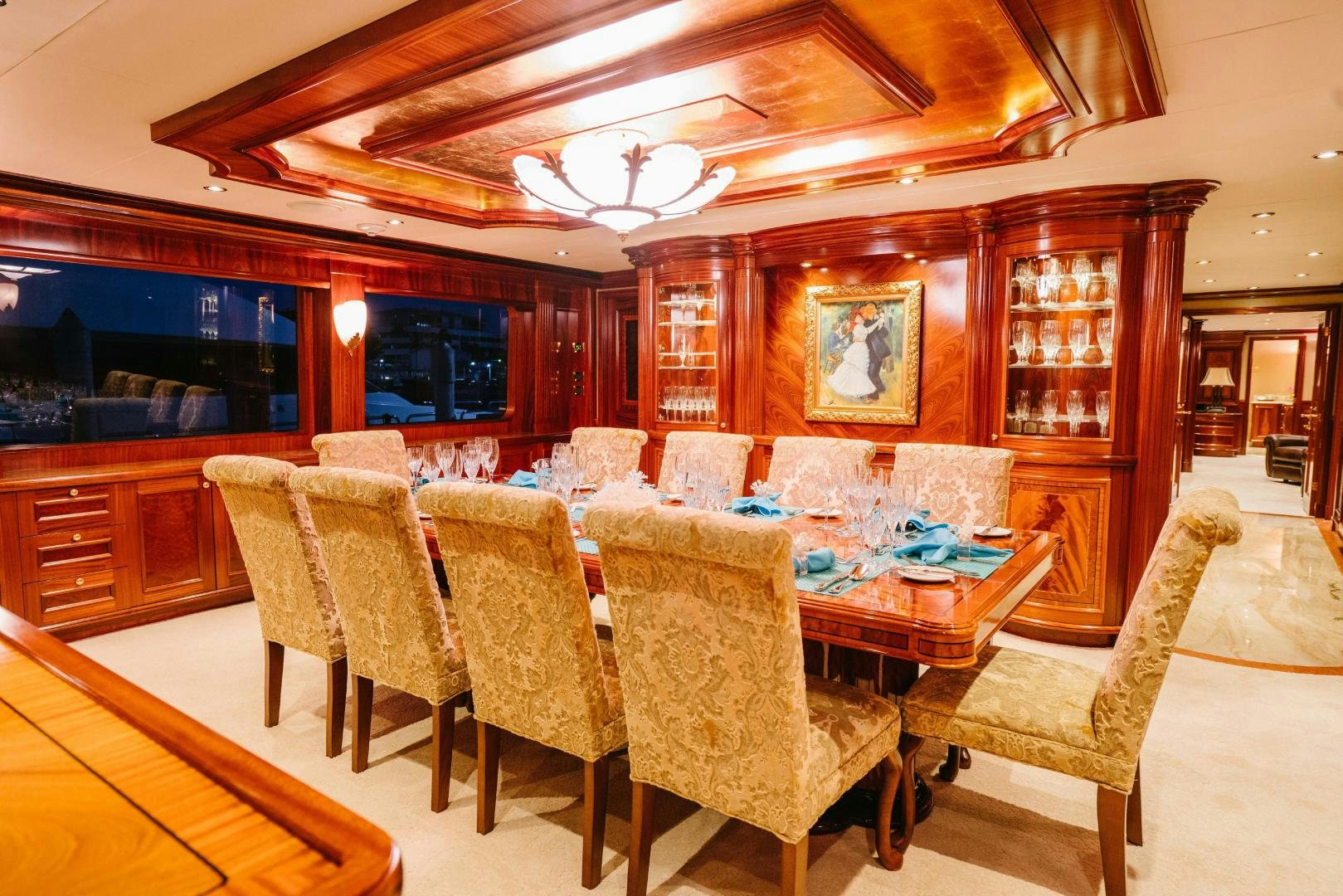 a dining room with a table and chairs aboard EXCELLENCE Yacht for Sale