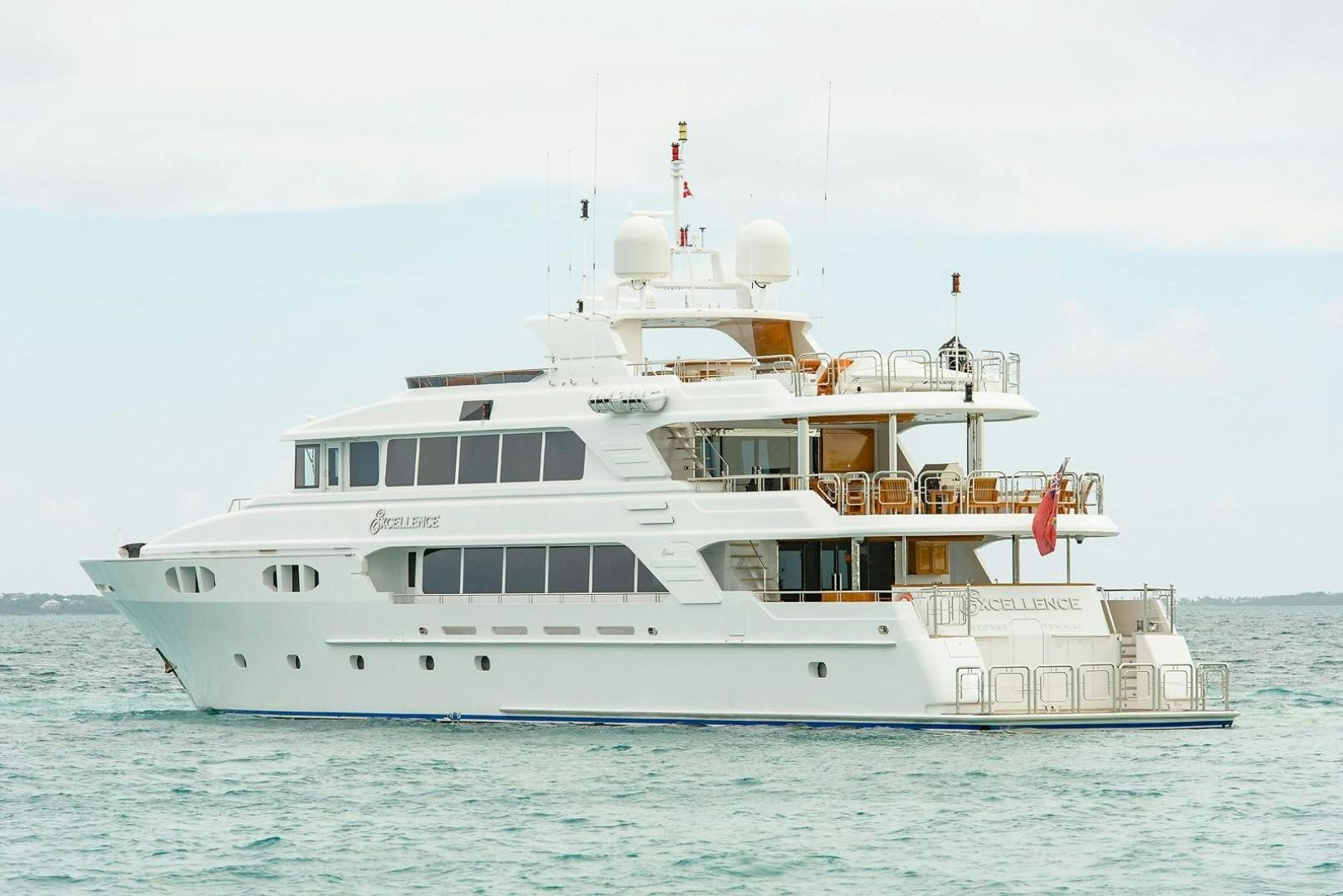 a large white boat in the water aboard EXCELLENCE Yacht for Sale