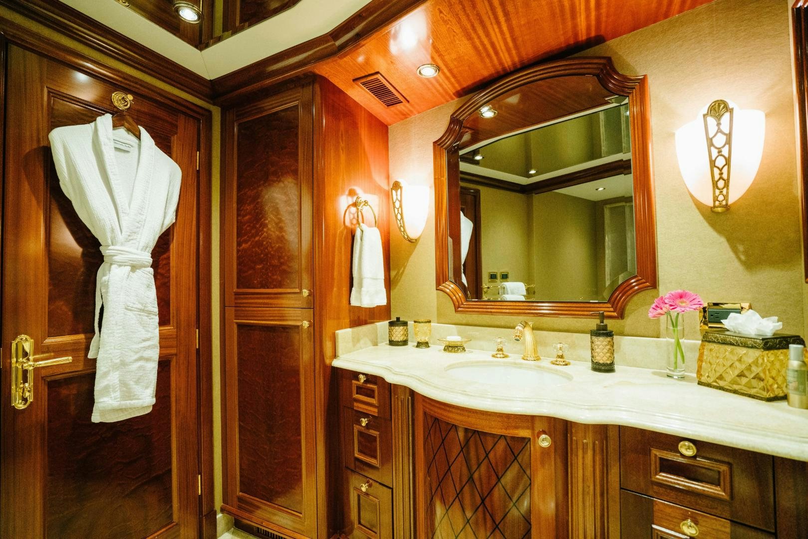 a bathroom with a large mirror aboard EXCELLENCE Yacht for Sale