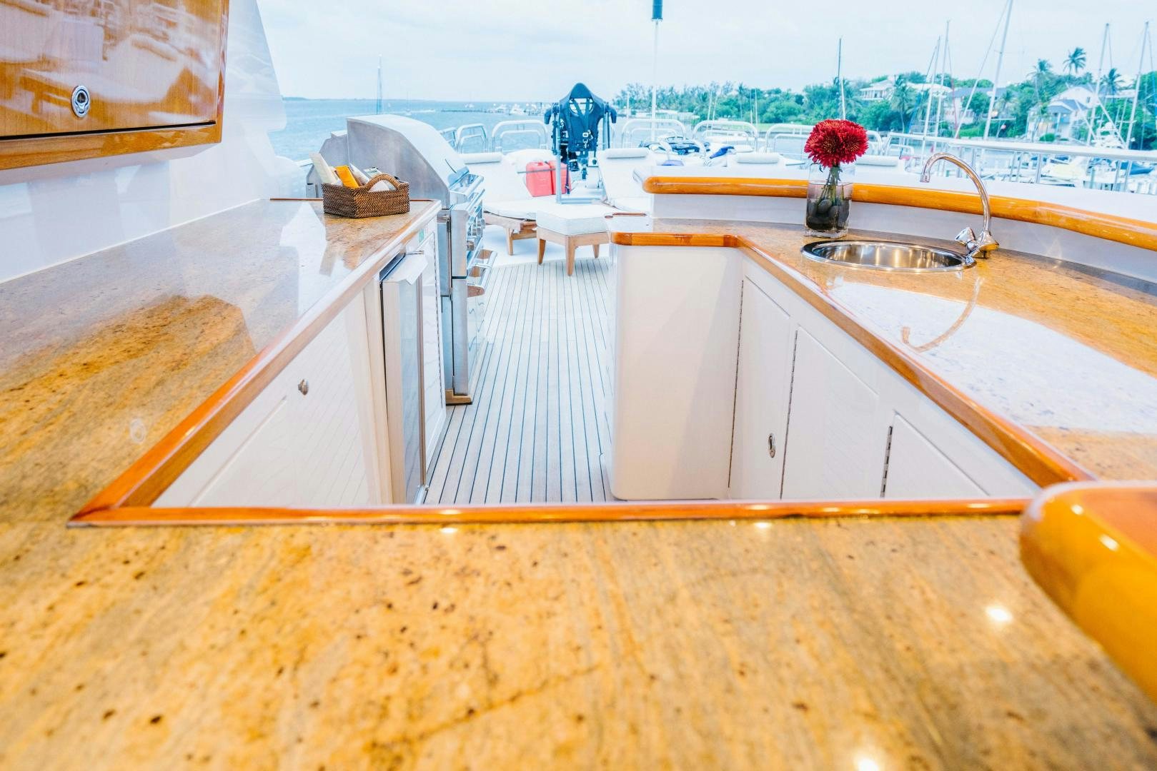 a kitchen with a large window overlooking the water aboard EXCELLENCE Yacht for Sale