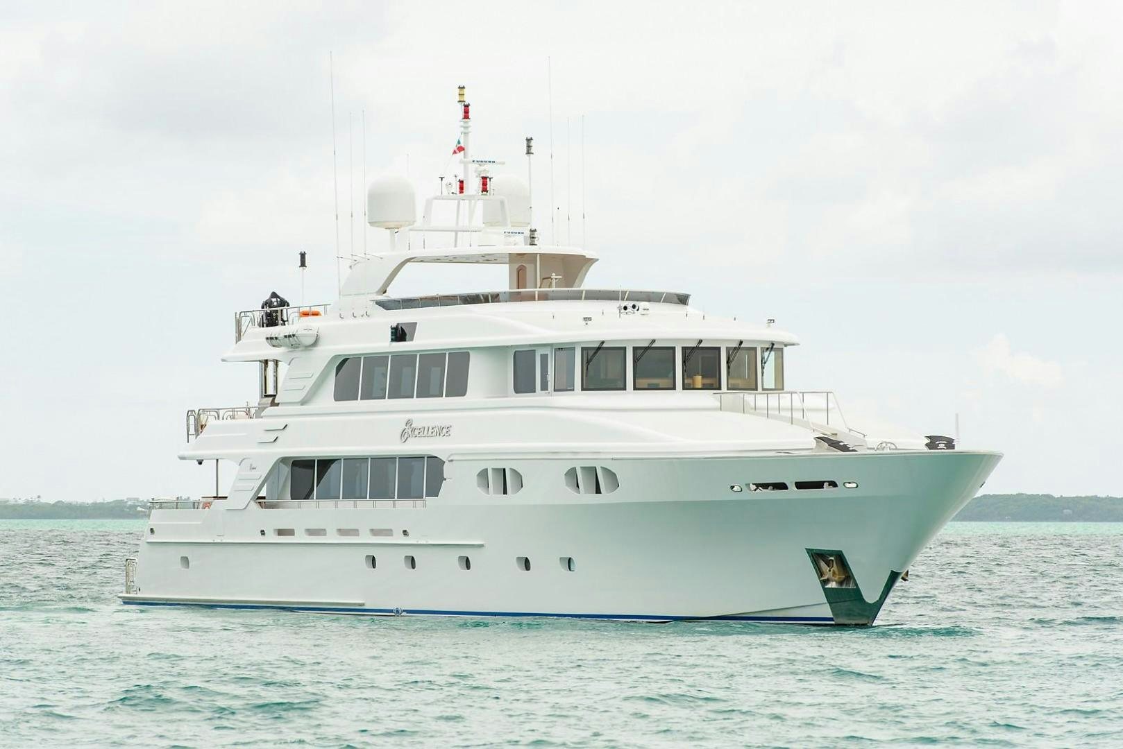 a white boat in the water aboard EXCELLENCE Yacht for Sale