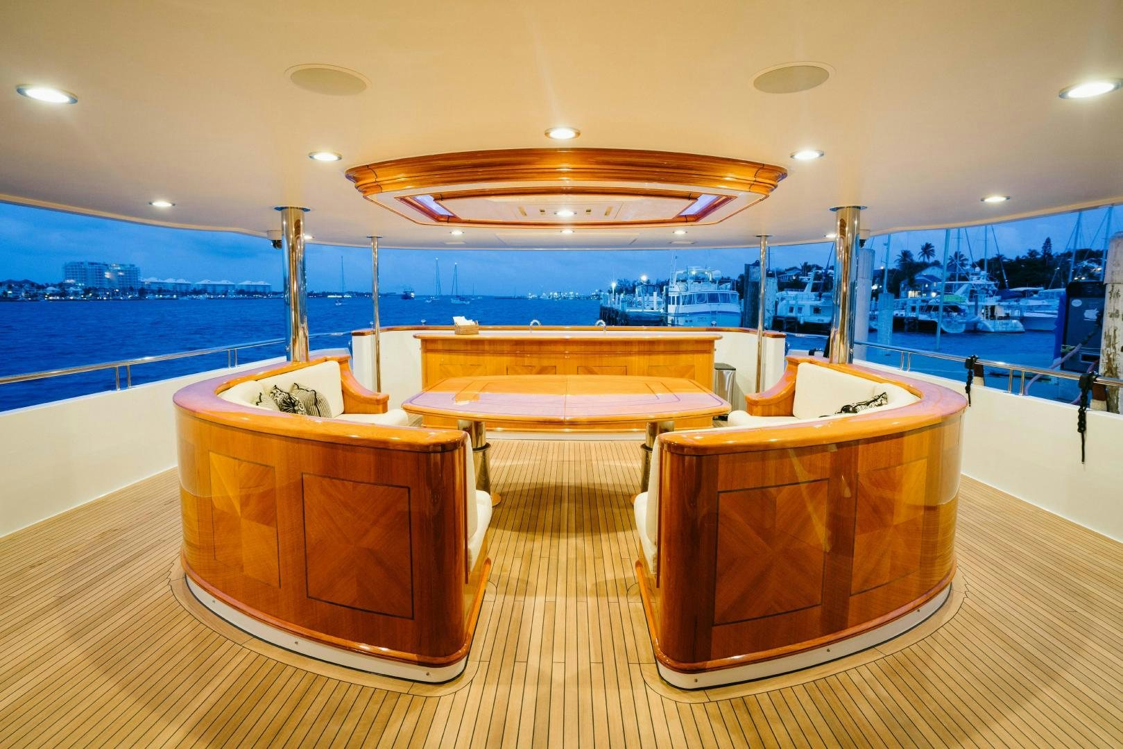 a room with a view of the water and the pool aboard EXCELLENCE Yacht for Sale