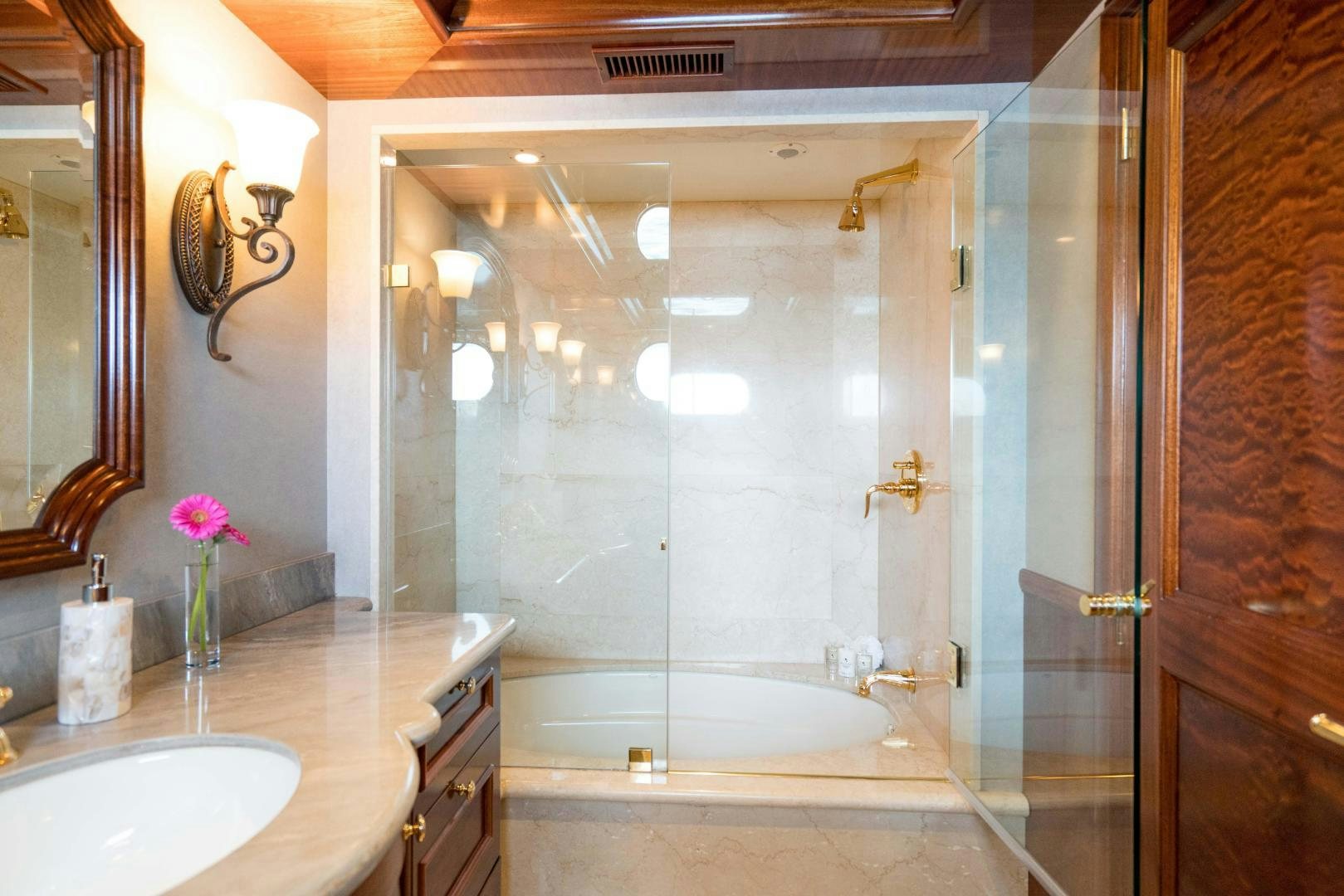 a bathroom with a glass shower aboard EXCELLENCE Yacht for Sale