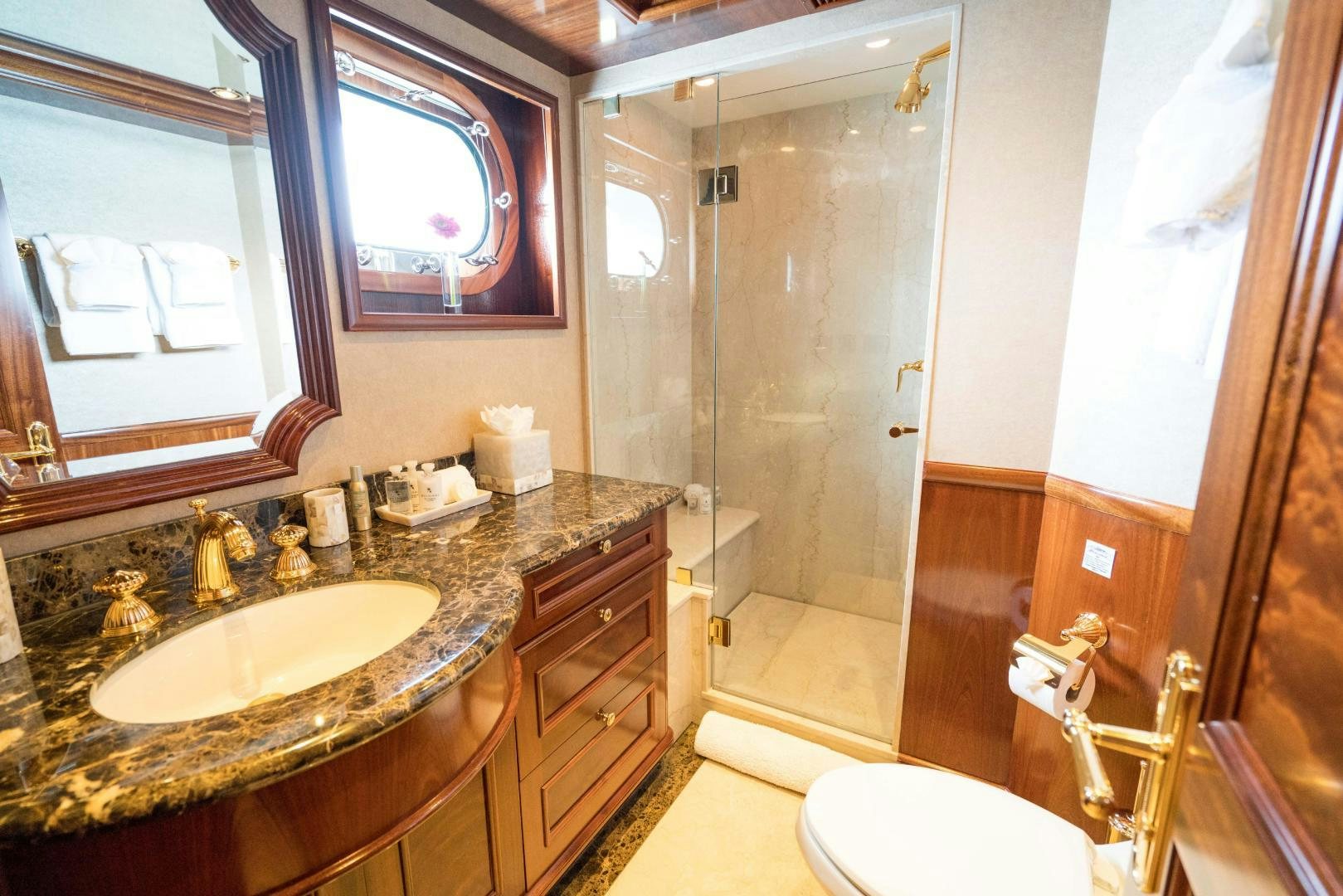 a bathroom with a sink and a shower aboard EXCELLENCE Yacht for Sale