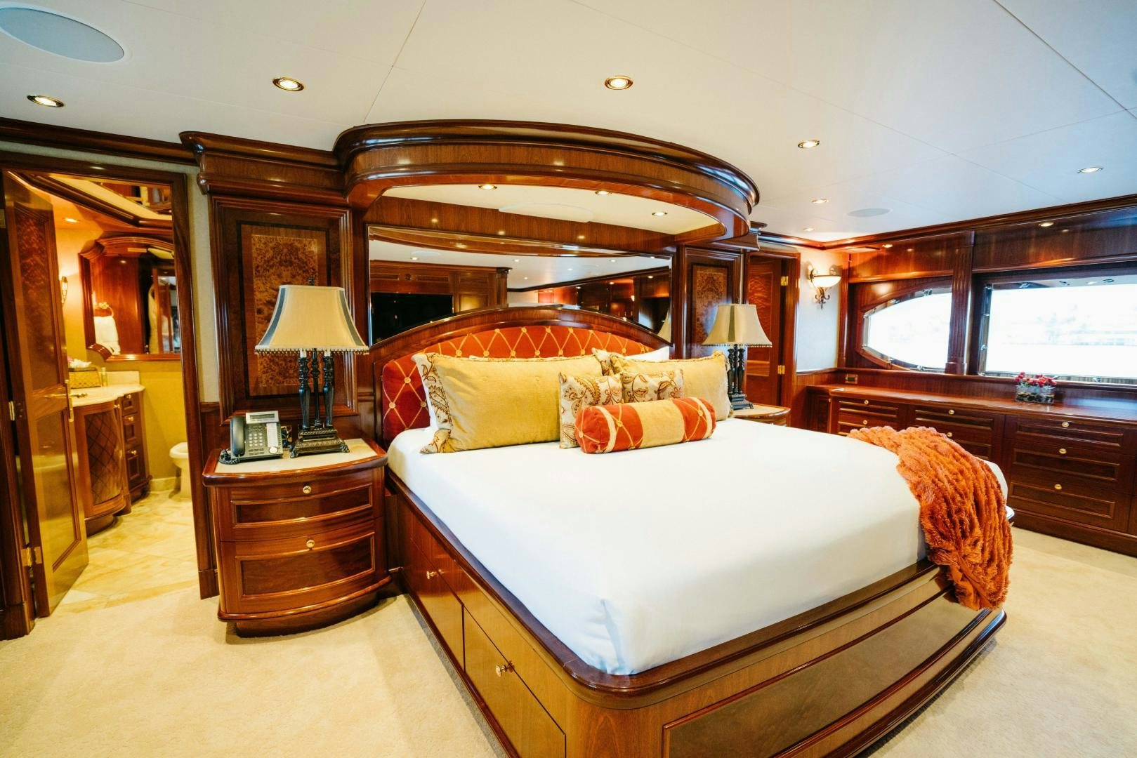 a bedroom with a large bed aboard EXCELLENCE Yacht for Sale