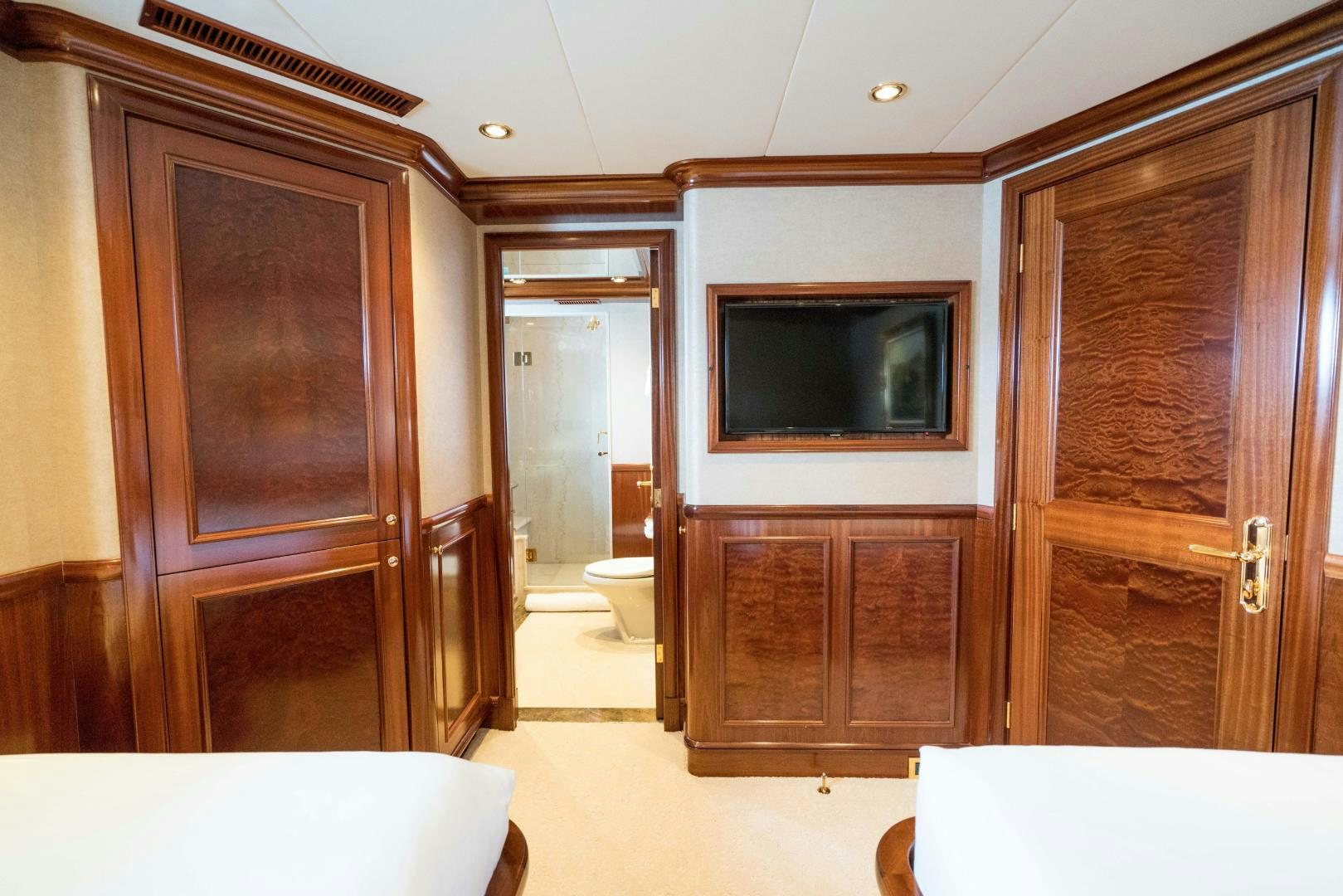 a room with wooden cabinets aboard EXCELLENCE Yacht for Sale