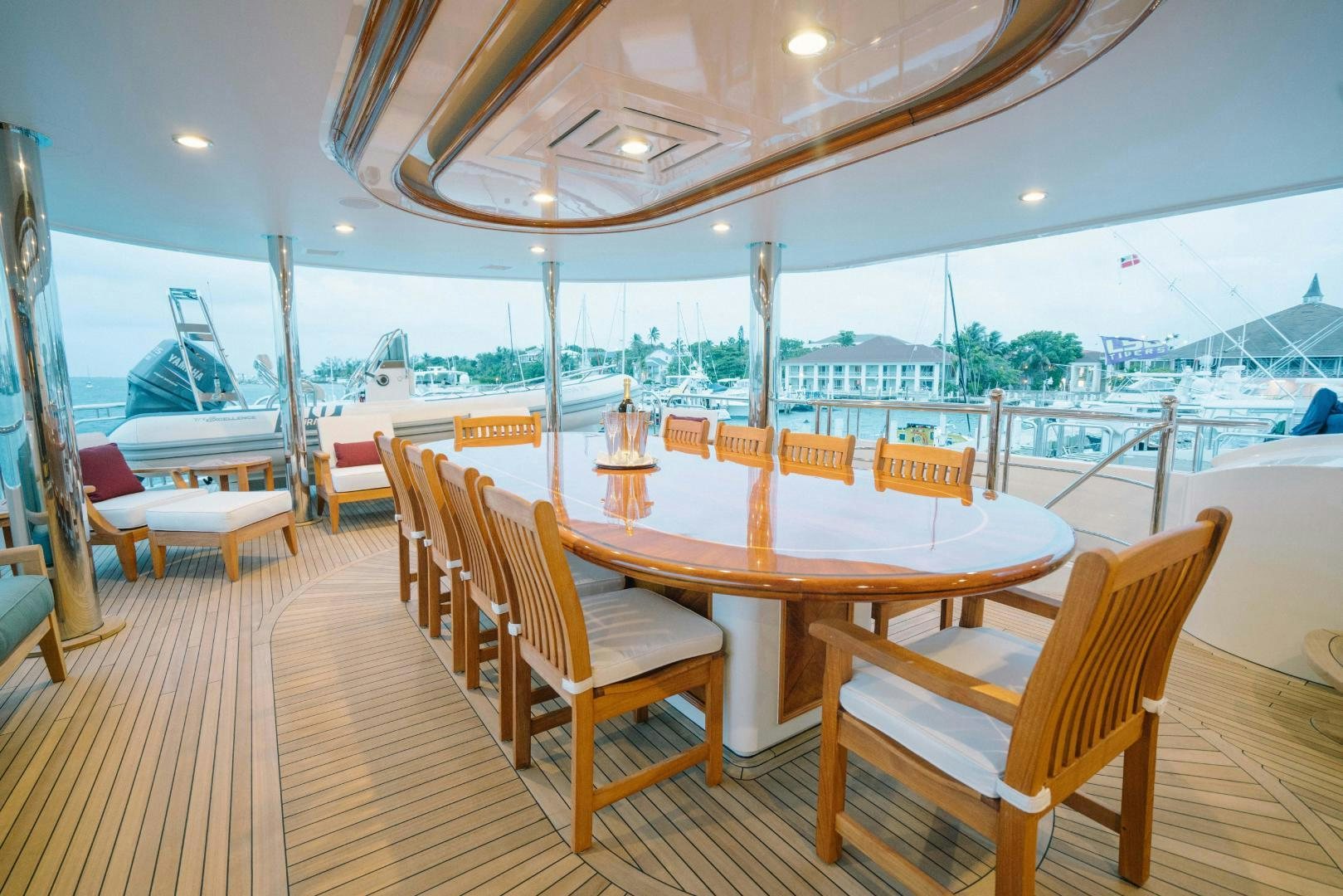 a table and chairs on a deck aboard EXCELLENCE Yacht for Sale