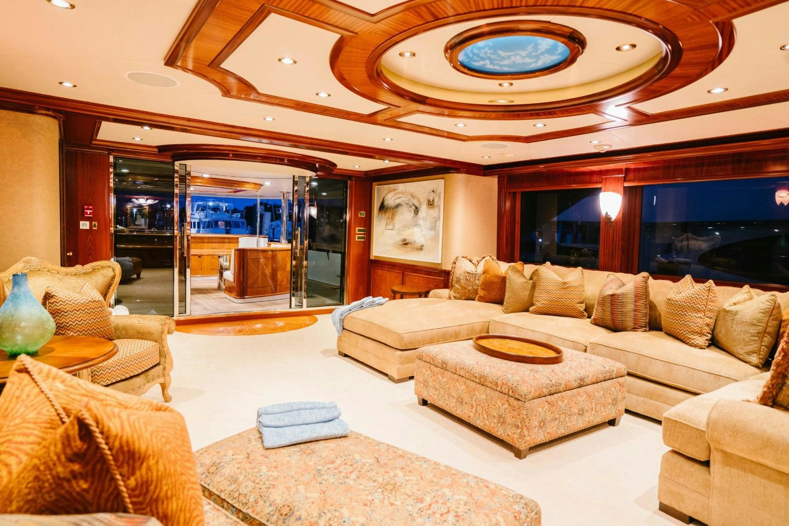a living room with a large glass window aboard EXCELLENCE Yacht for Sale