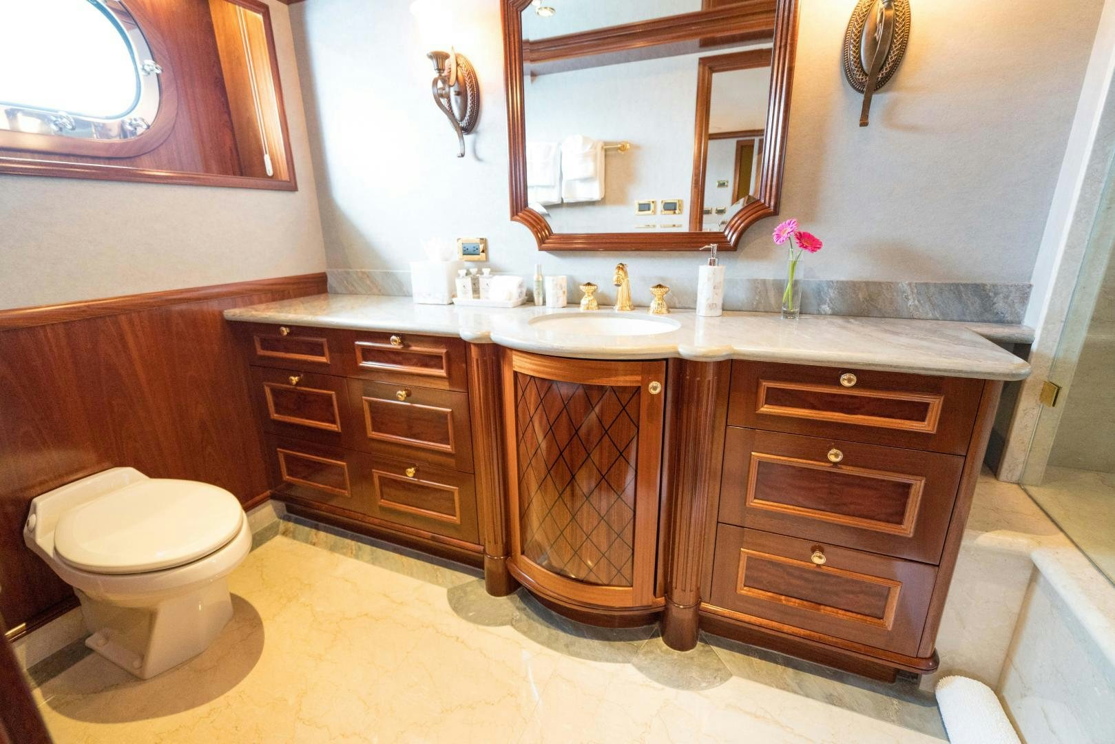 a bathroom with a sink and a toilet aboard EXCELLENCE Yacht for Sale