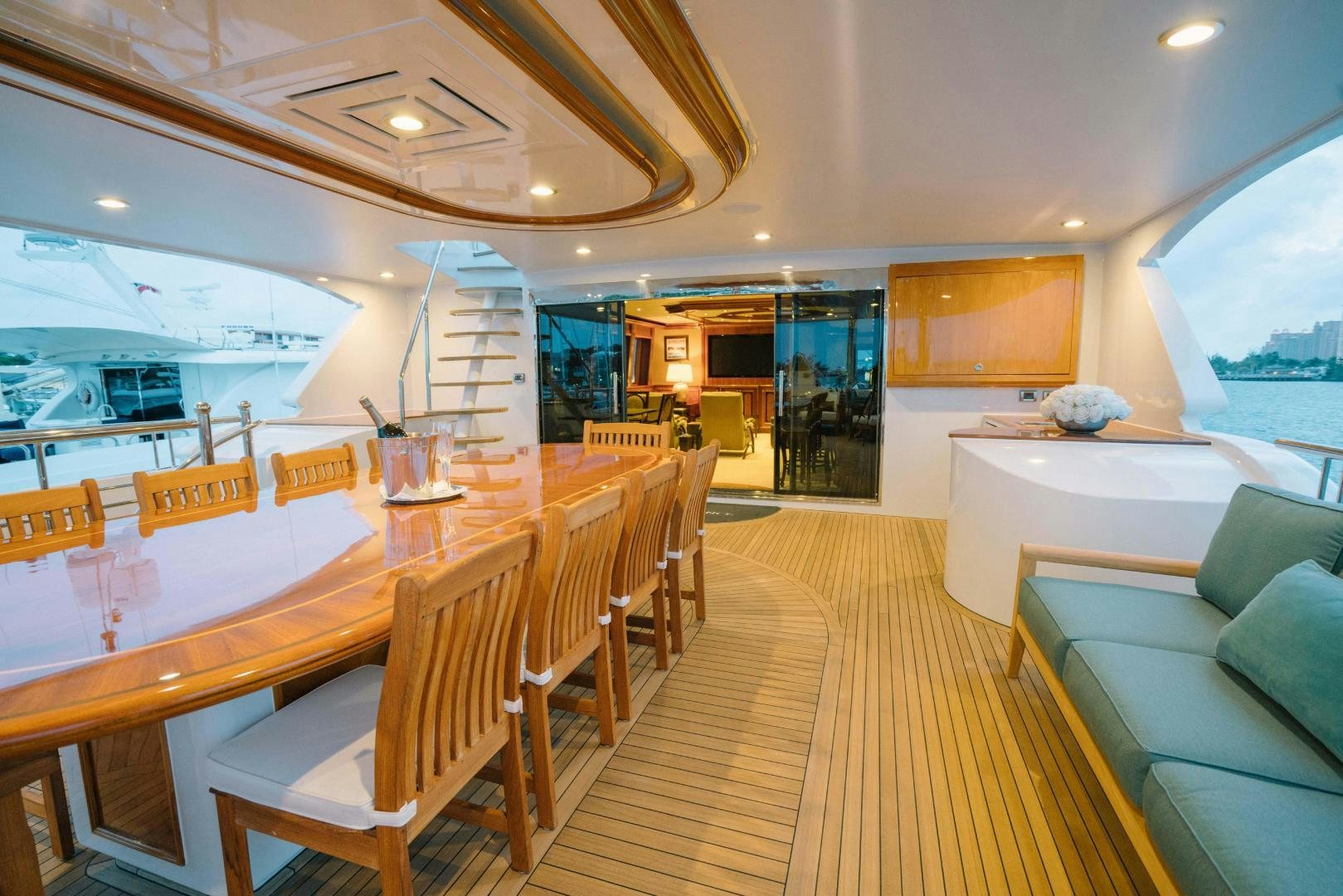 a large room with a table and chairs aboard EXCELLENCE Yacht for Sale