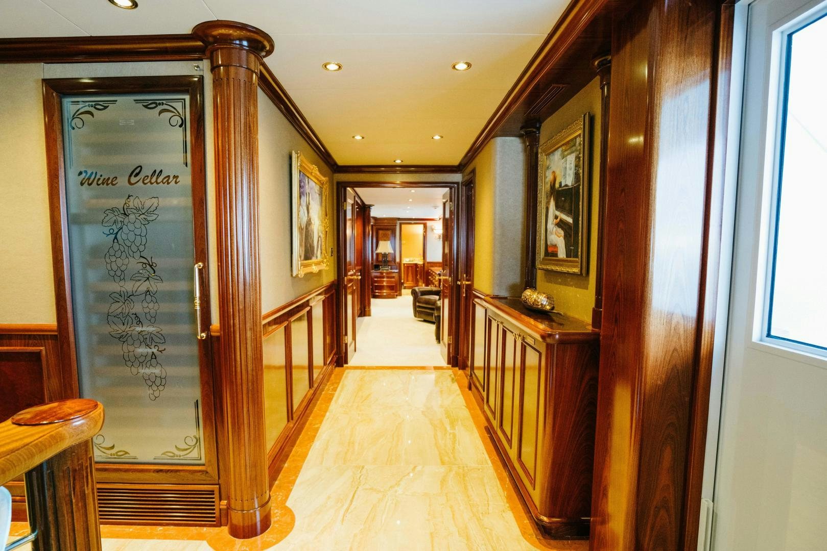 a hallway with a wood door aboard EXCELLENCE Yacht for Sale