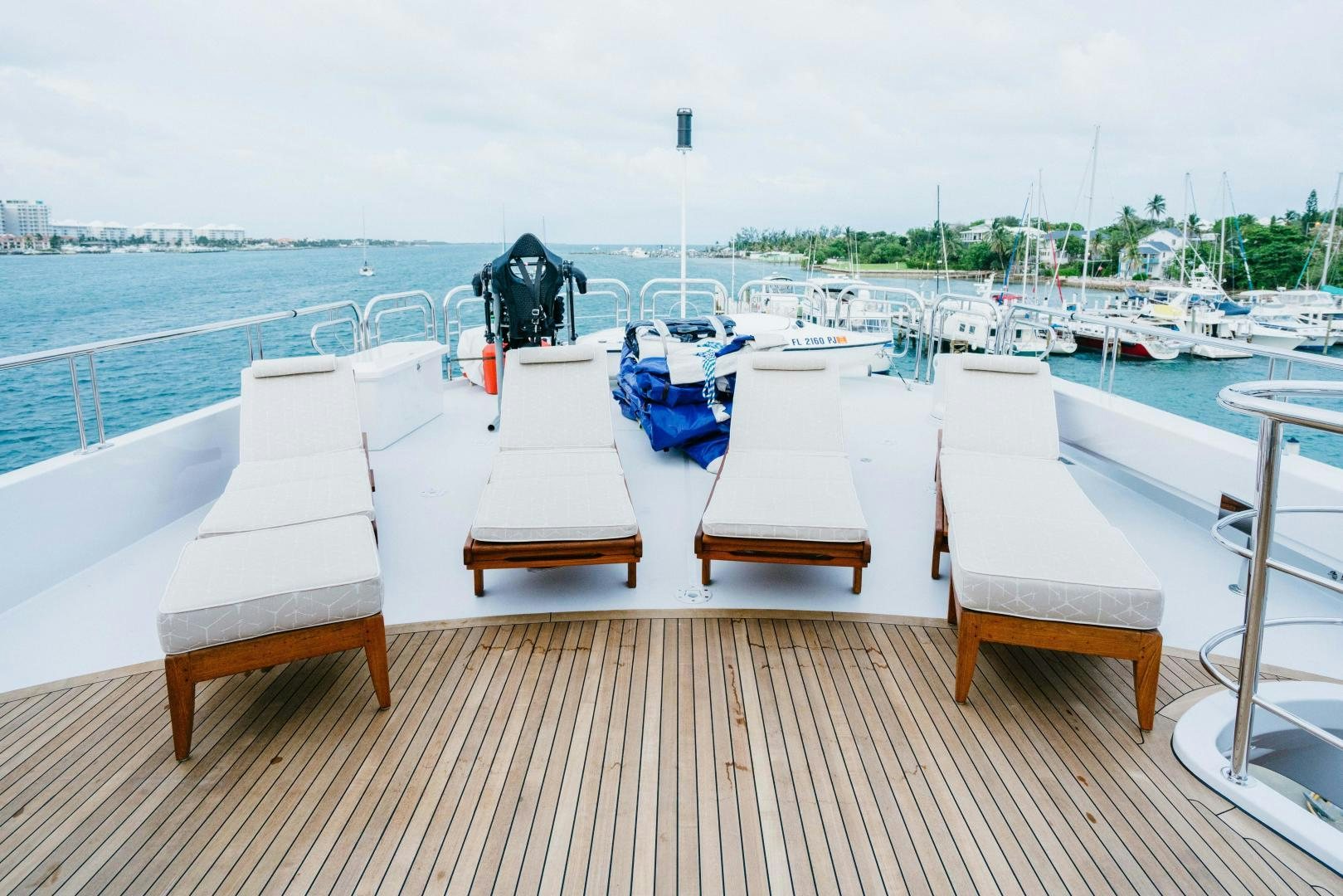 a group of chairs on a dock aboard EXCELLENCE Yacht for Sale