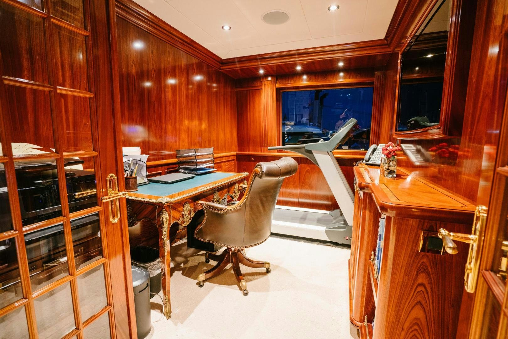 a room with a desk and a chair aboard EXCELLENCE Yacht for Sale