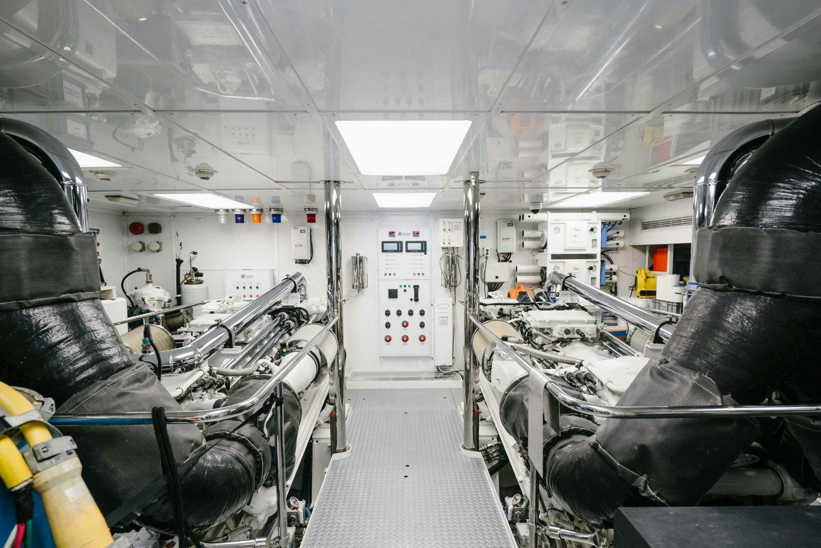 a room with equipment and chairs aboard EXCELLENCE Yacht for Sale