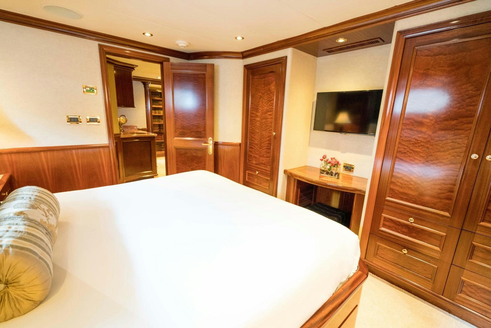 a bed in a room aboard EXCELLENCE Yacht for Sale