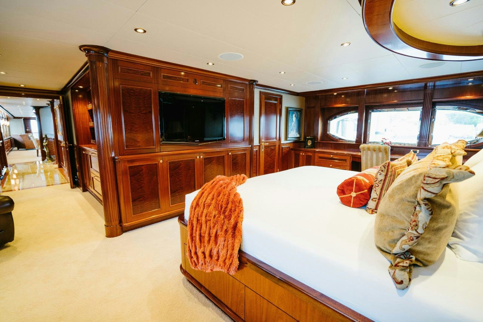 a bedroom with a large bed aboard EXCELLENCE Yacht for Sale