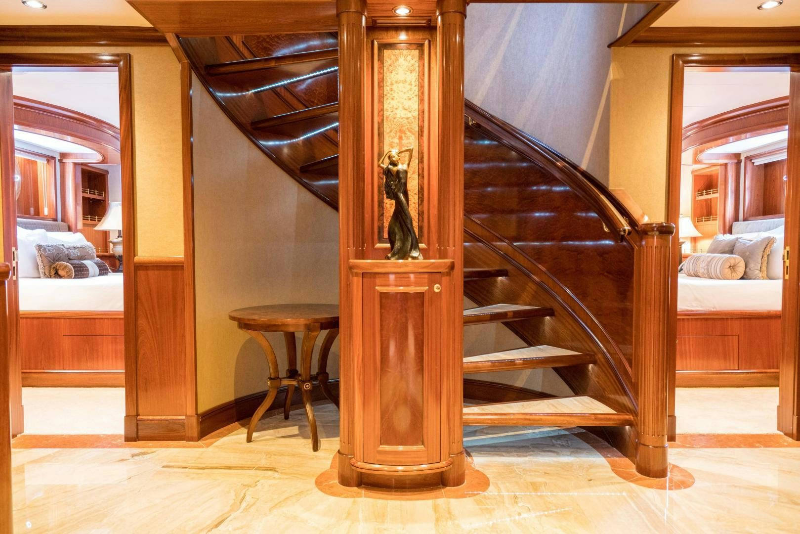 a large wooden staircase aboard EXCELLENCE Yacht for Sale