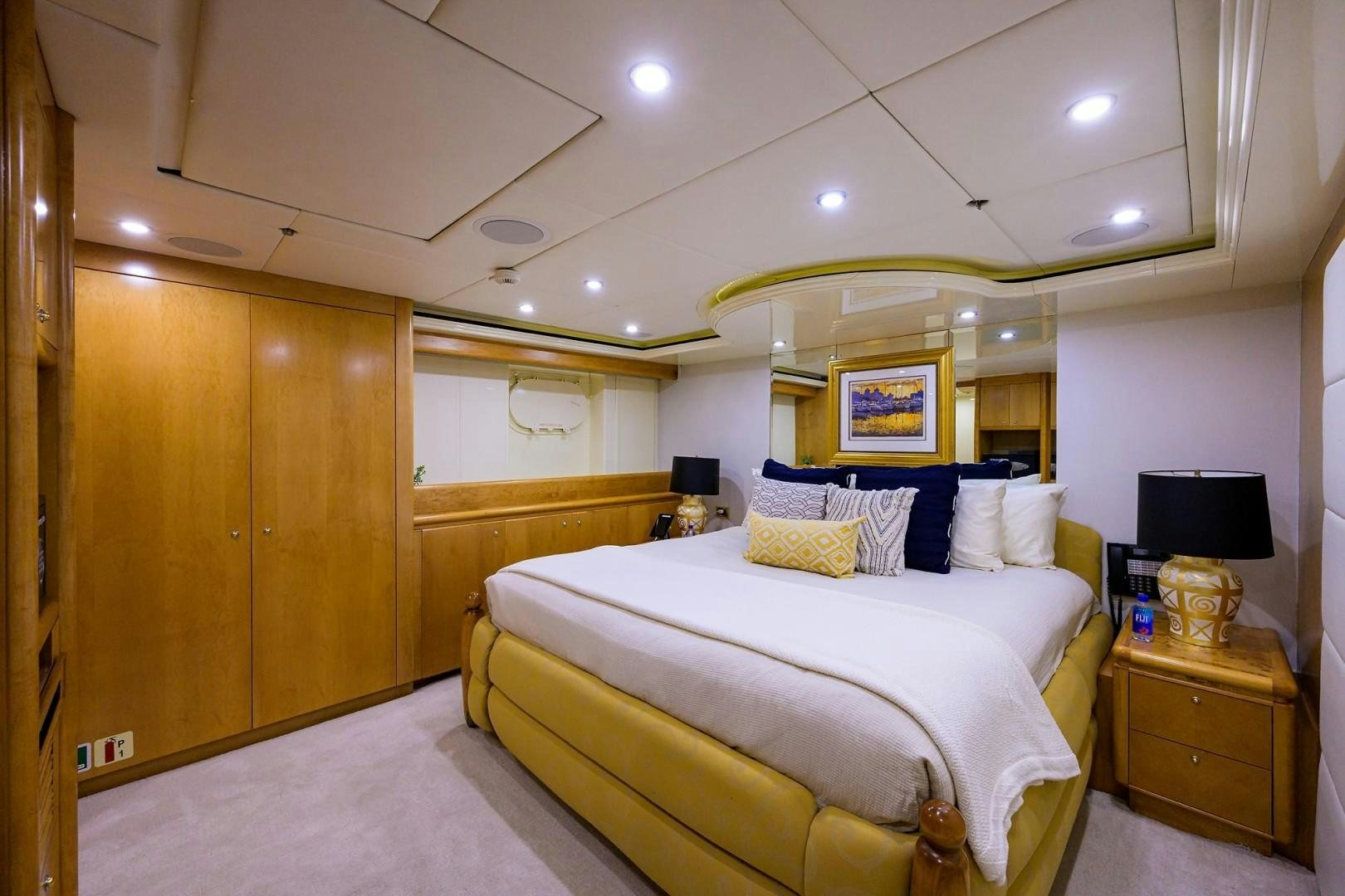 a bedroom with a bed and a television aboard CABERNET Yacht for Sale