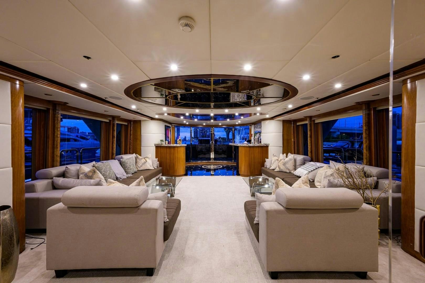 a living room with white couches aboard CABERNET Yacht for Sale